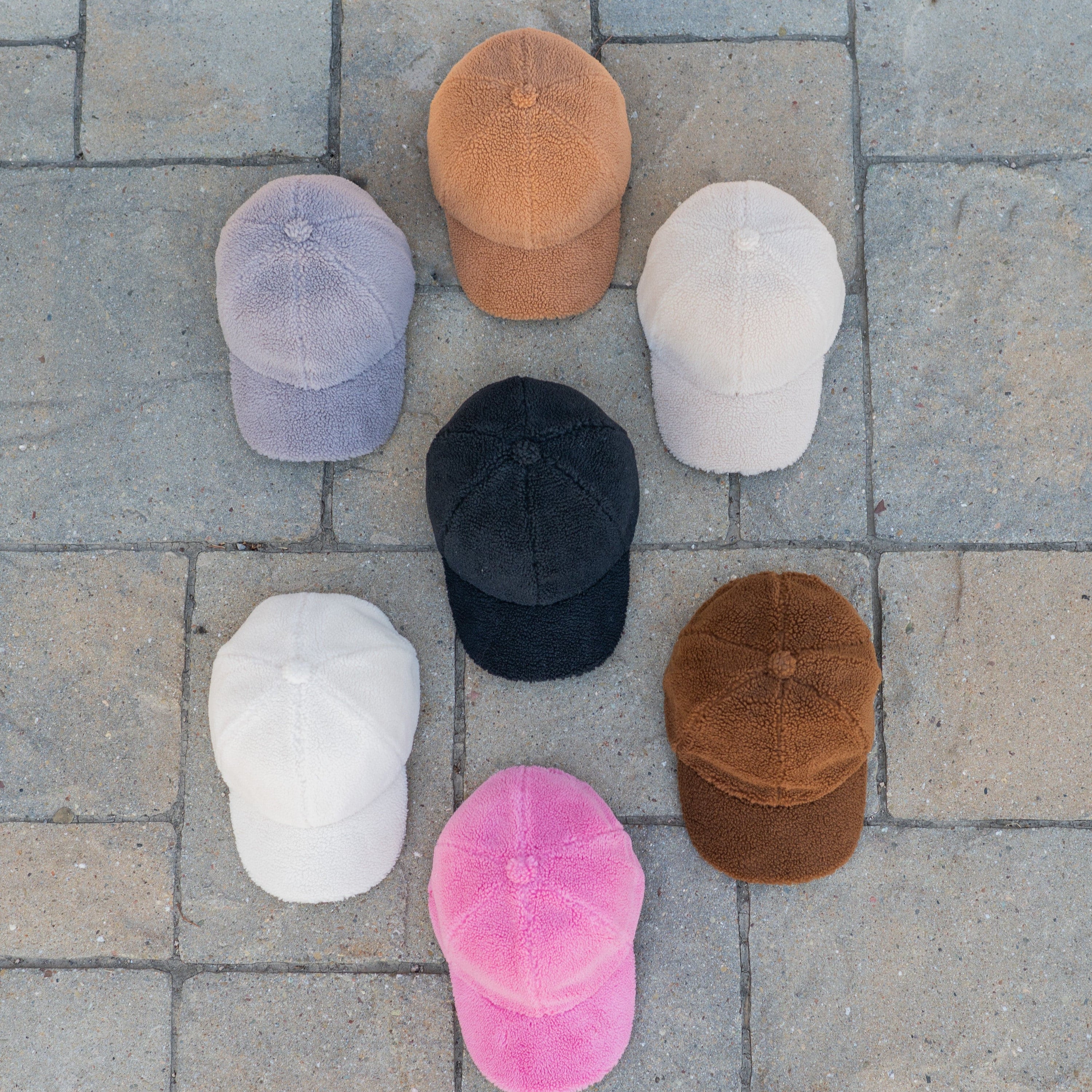 CC Cozy Sherpa Cap featuring soft sherpa material and adjustable velcro strap, suitable for youth and adults.