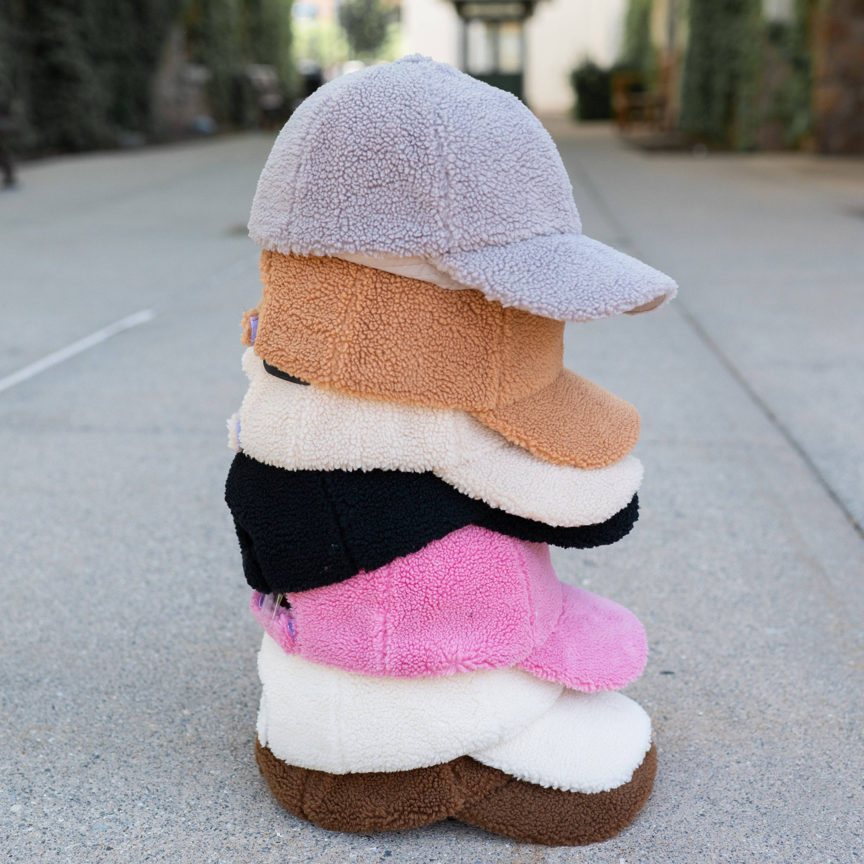 CC Cozy Sherpa Cap featuring soft sherpa material and adjustable velcro strap, suitable for youth and adults.