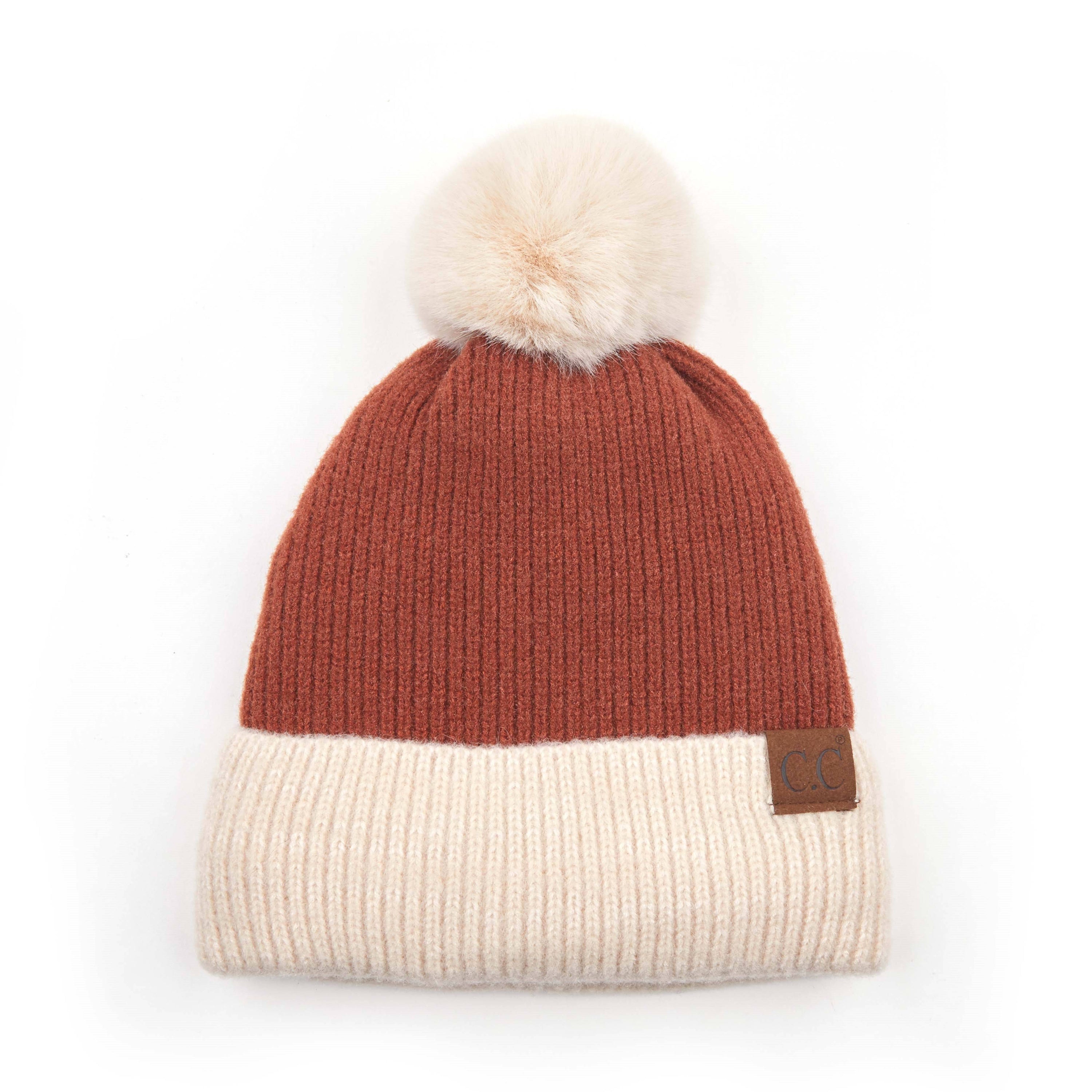 CC Festive Beanie featuring a faux fur pom and metallic detail, perfect for winter style.