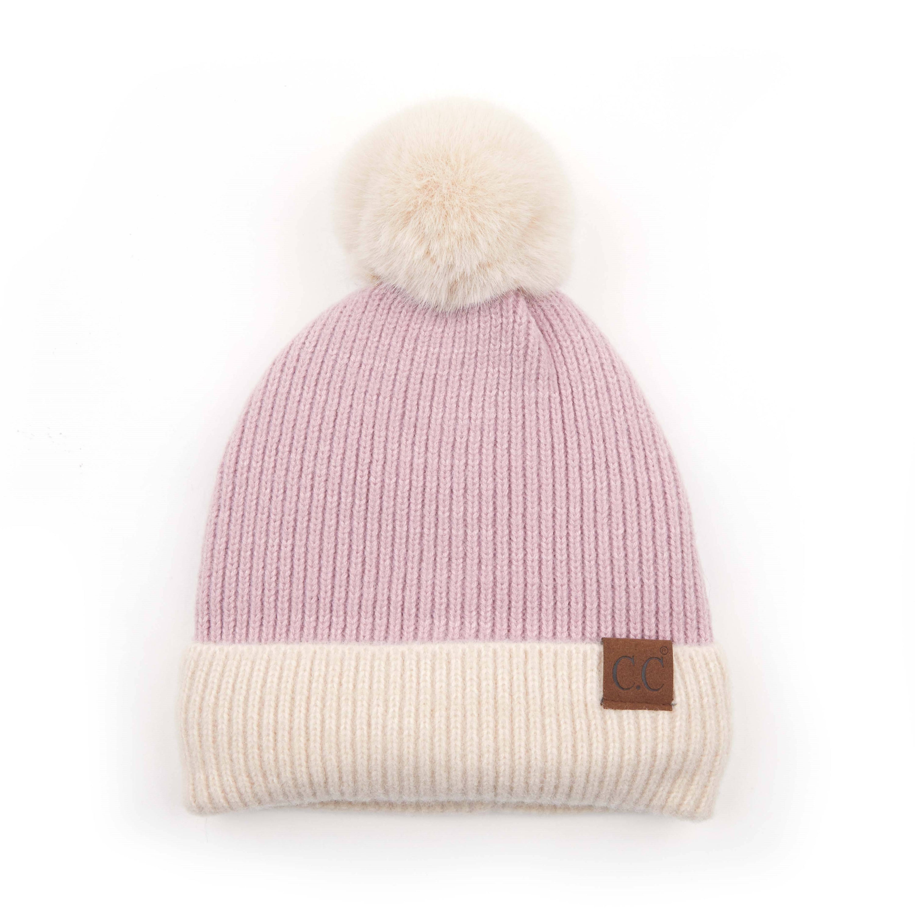 CC Festive Beanie featuring a faux fur pom and metallic detail, perfect for winter style.