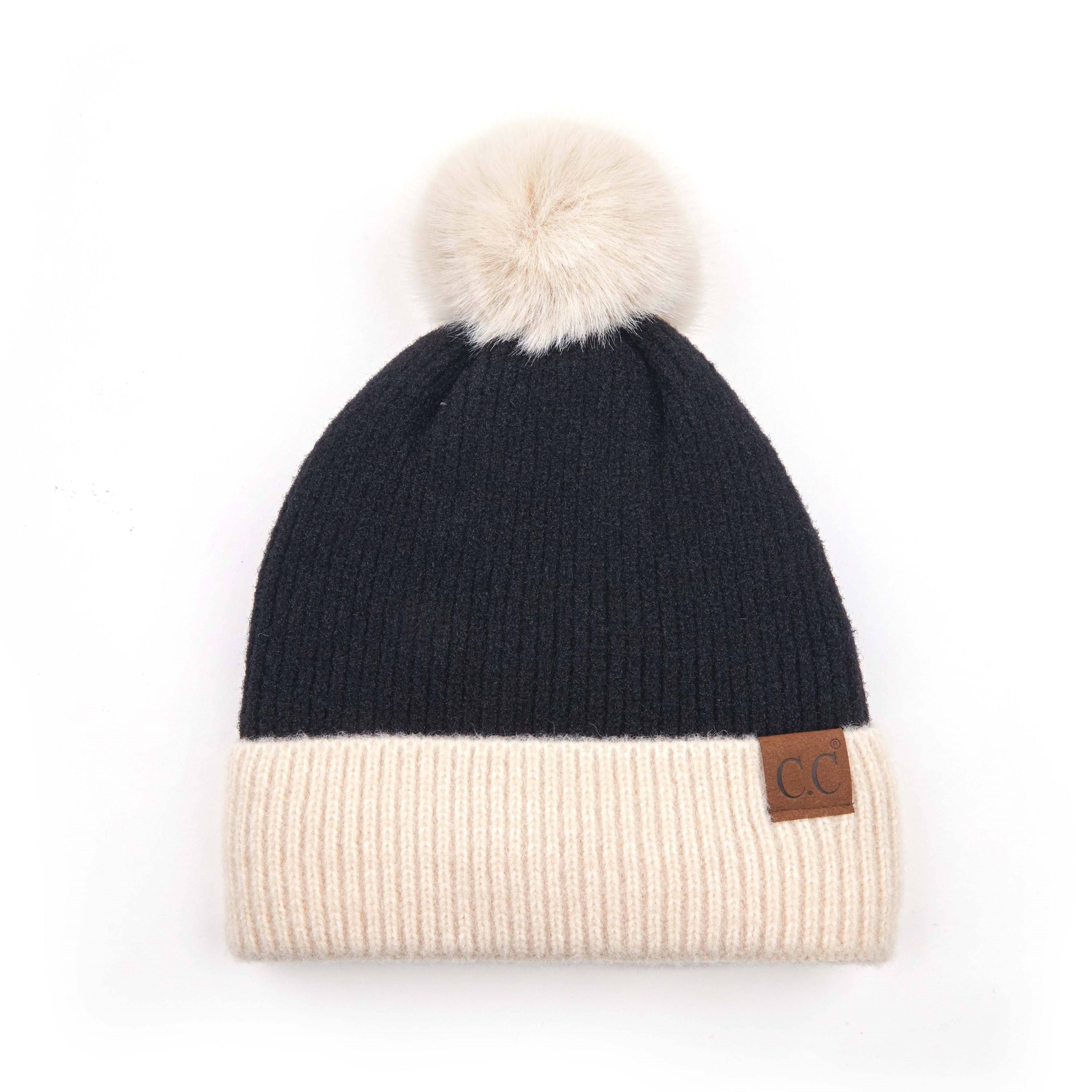 CC Festive Beanie featuring a faux fur pom and metallic detail, perfect for winter style.