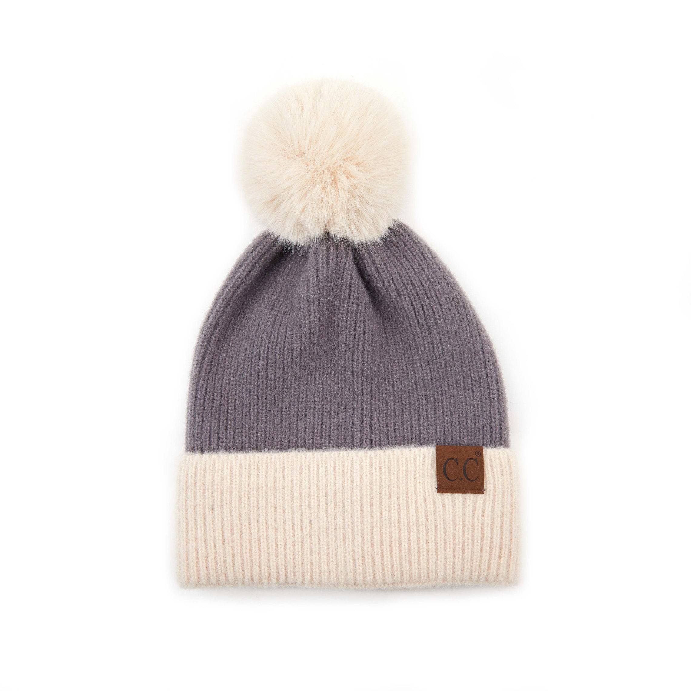 CC Festive Beanie featuring a faux fur pom and metallic detail, perfect for winter style.