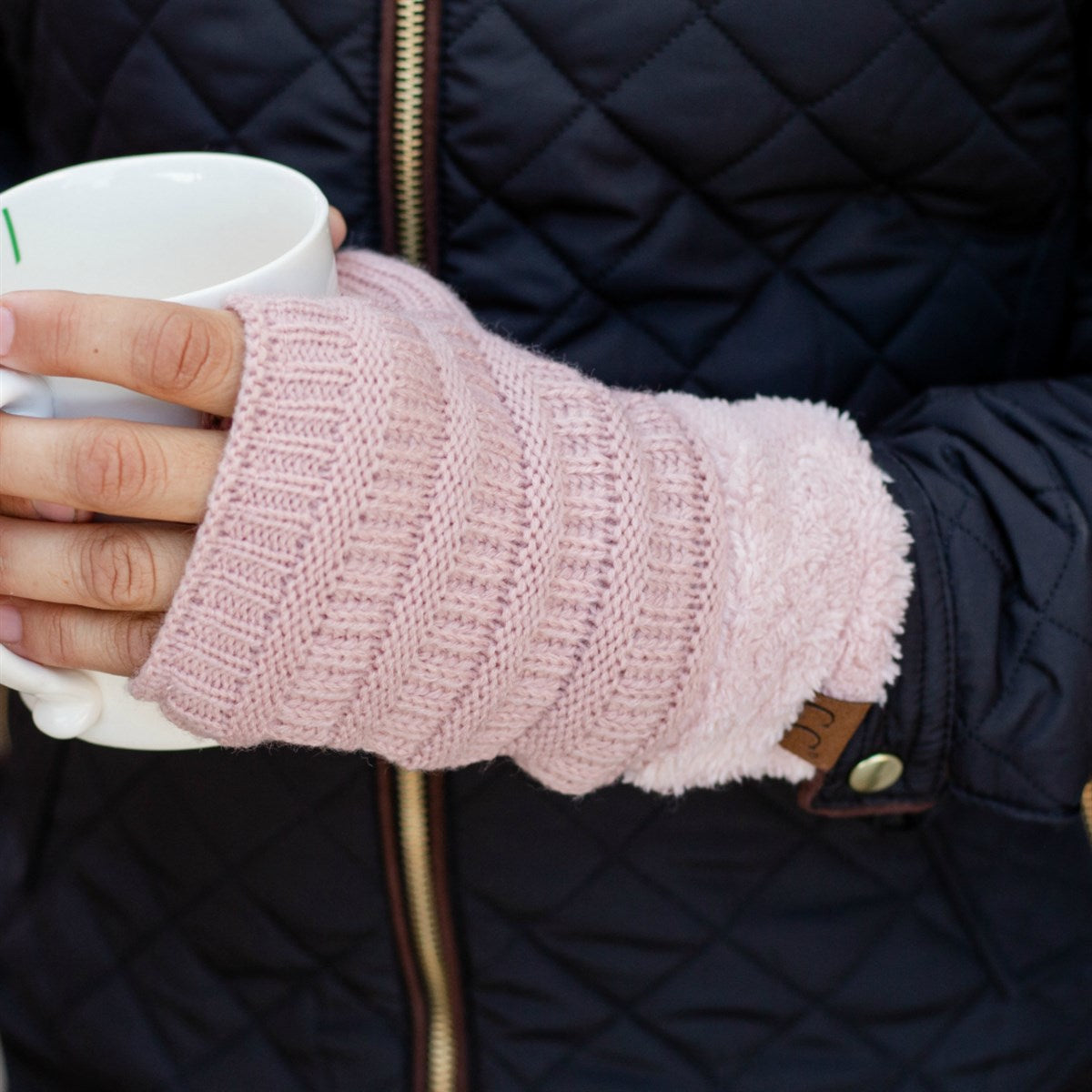 C.C Fingerless Gloves in various colors with faux fur lining, showcasing a stylish cable knit design.