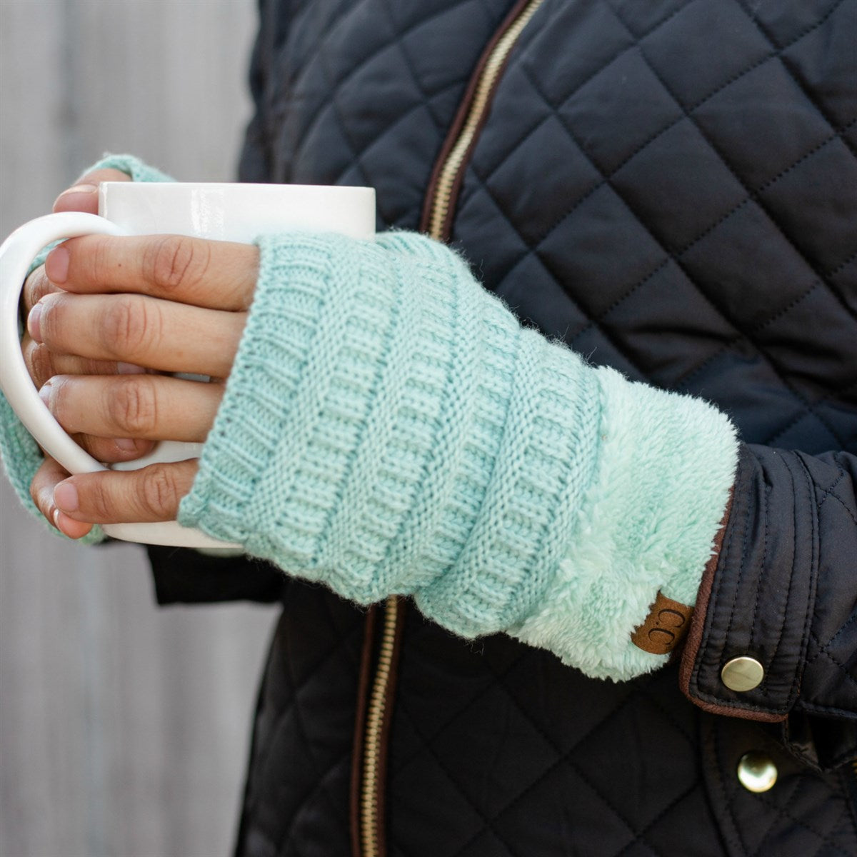 C.C Fingerless Gloves in various colors with faux fur lining, showcasing a stylish cable knit design.