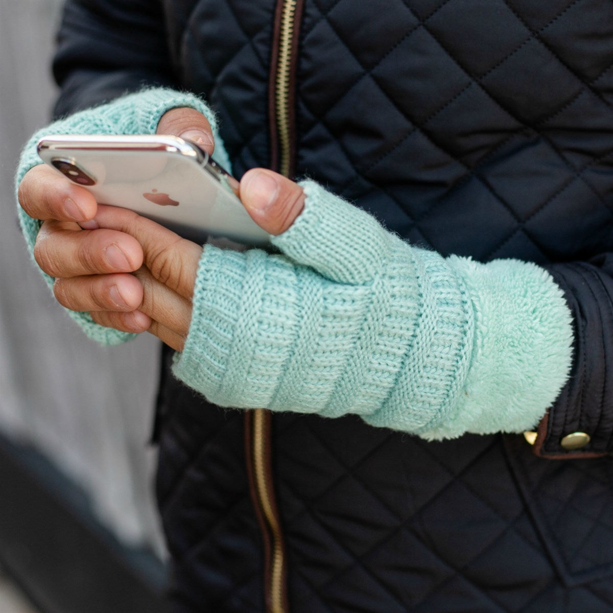 C.C Fingerless Gloves in various colors with faux fur lining, showcasing a stylish cable knit design.