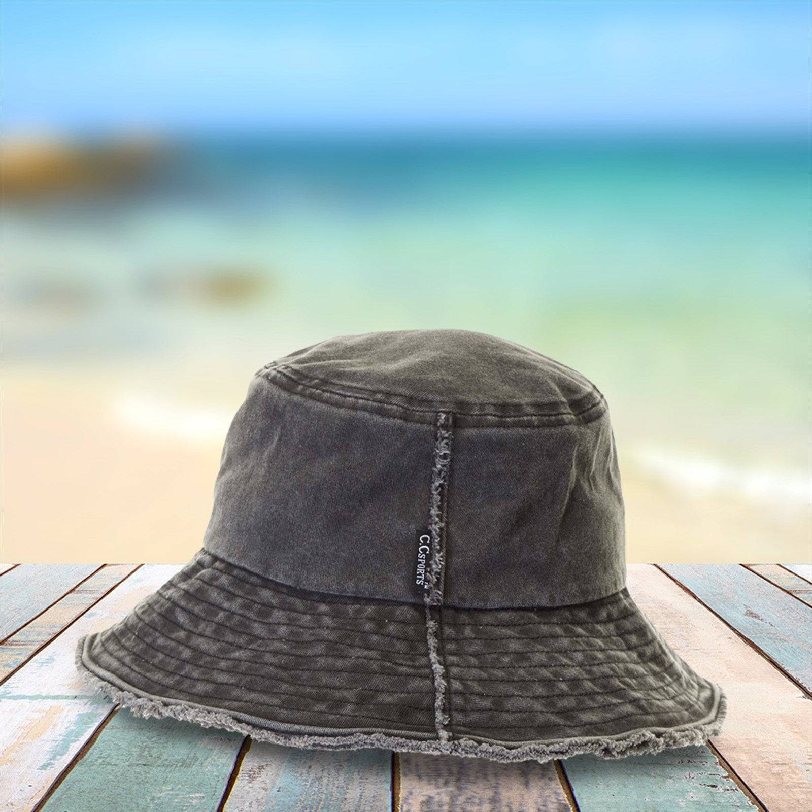 CC Frayed Washed Denim Bucket Hat with frayed edges and wide brim, perfect for sun protection and outdoor activities.