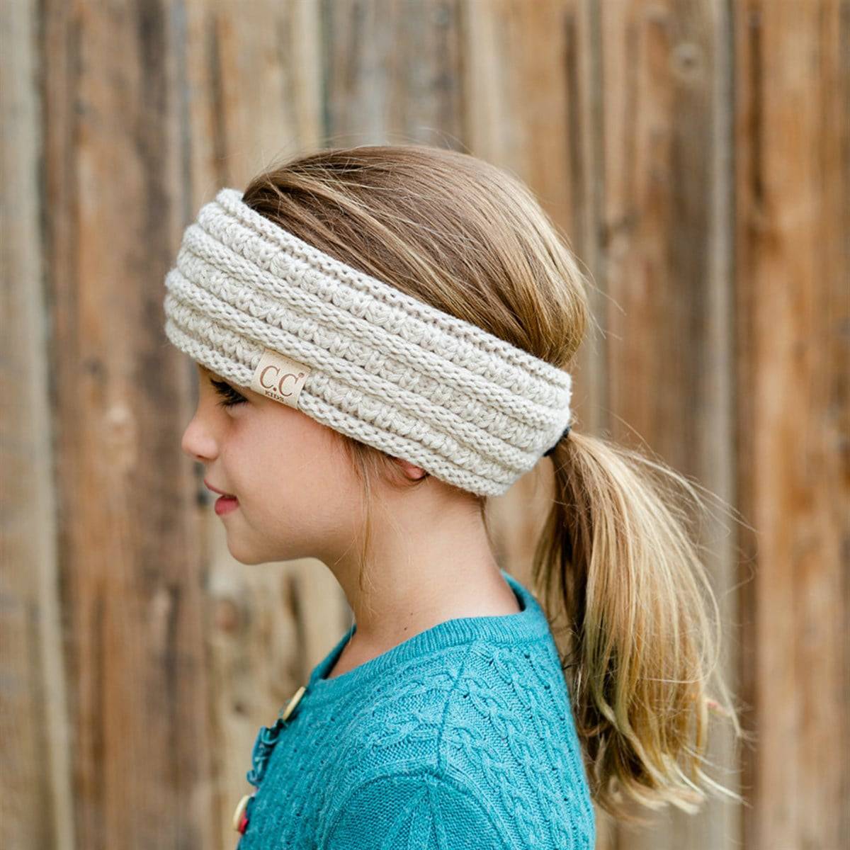 CC Kids Head Band Pony Opening in various colors, featuring a back ponytail access and fleece lining for warmth.