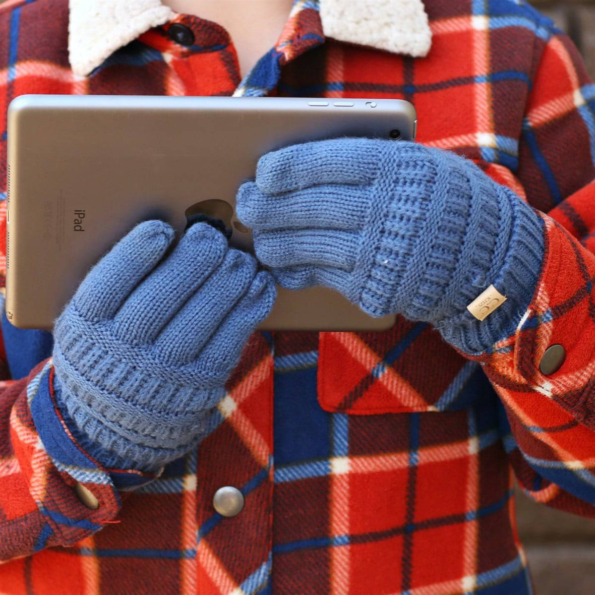 A pair of CC Kids Touchscreen Gloves in various colors, showcasing their soft texture and touchscreen fingertips.