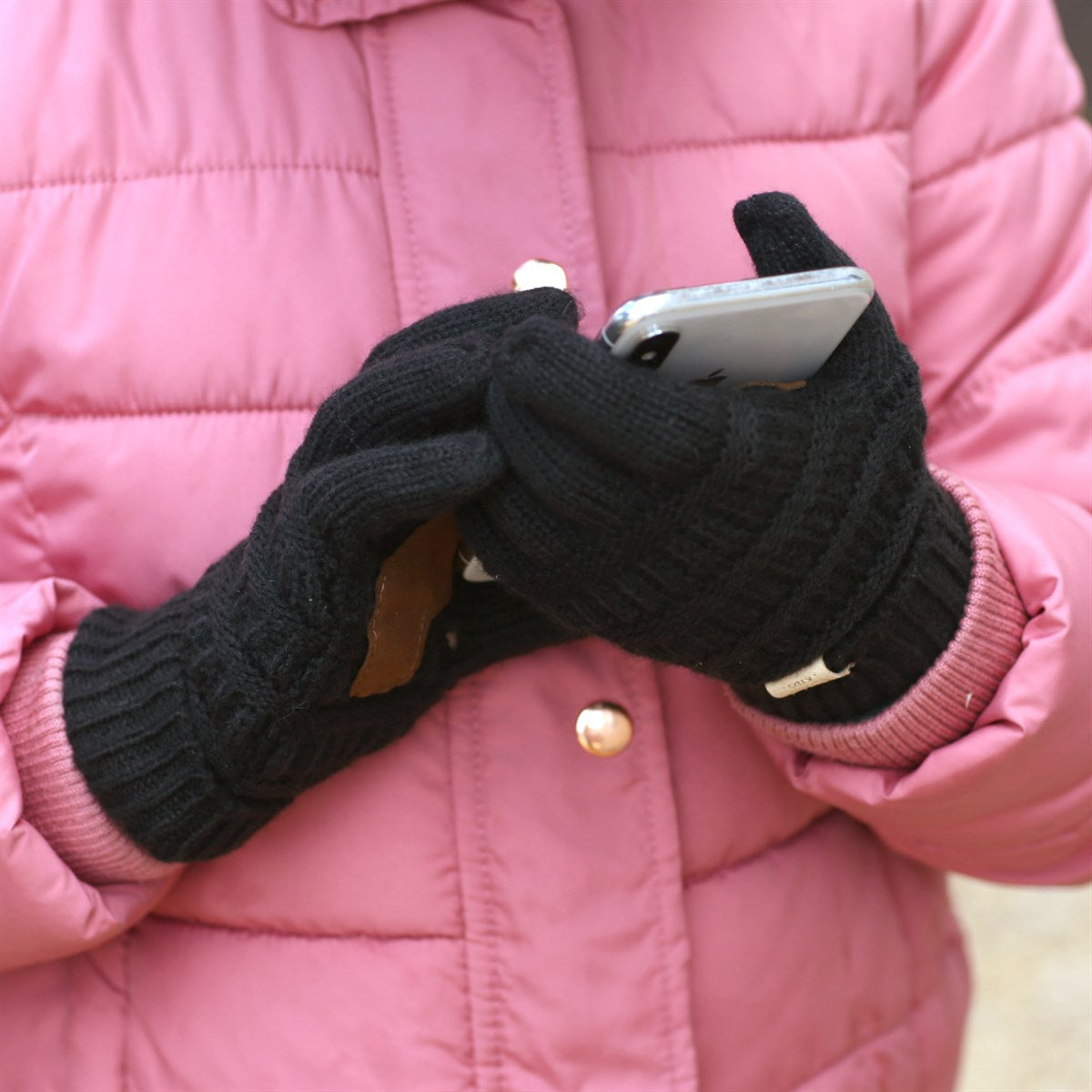 A pair of CC Kids Touchscreen Gloves in various colors, showcasing their soft texture and touchscreen fingertips.