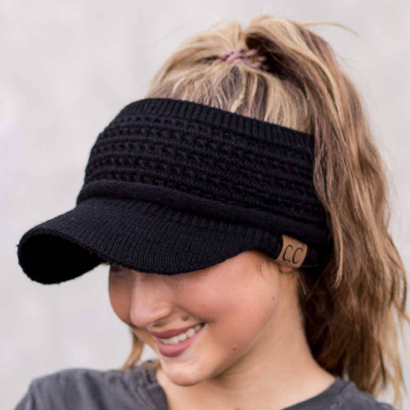 CC Knitted Visor featuring a wide brim and opening for ponytails, made from soft acrylic in a stylish design.