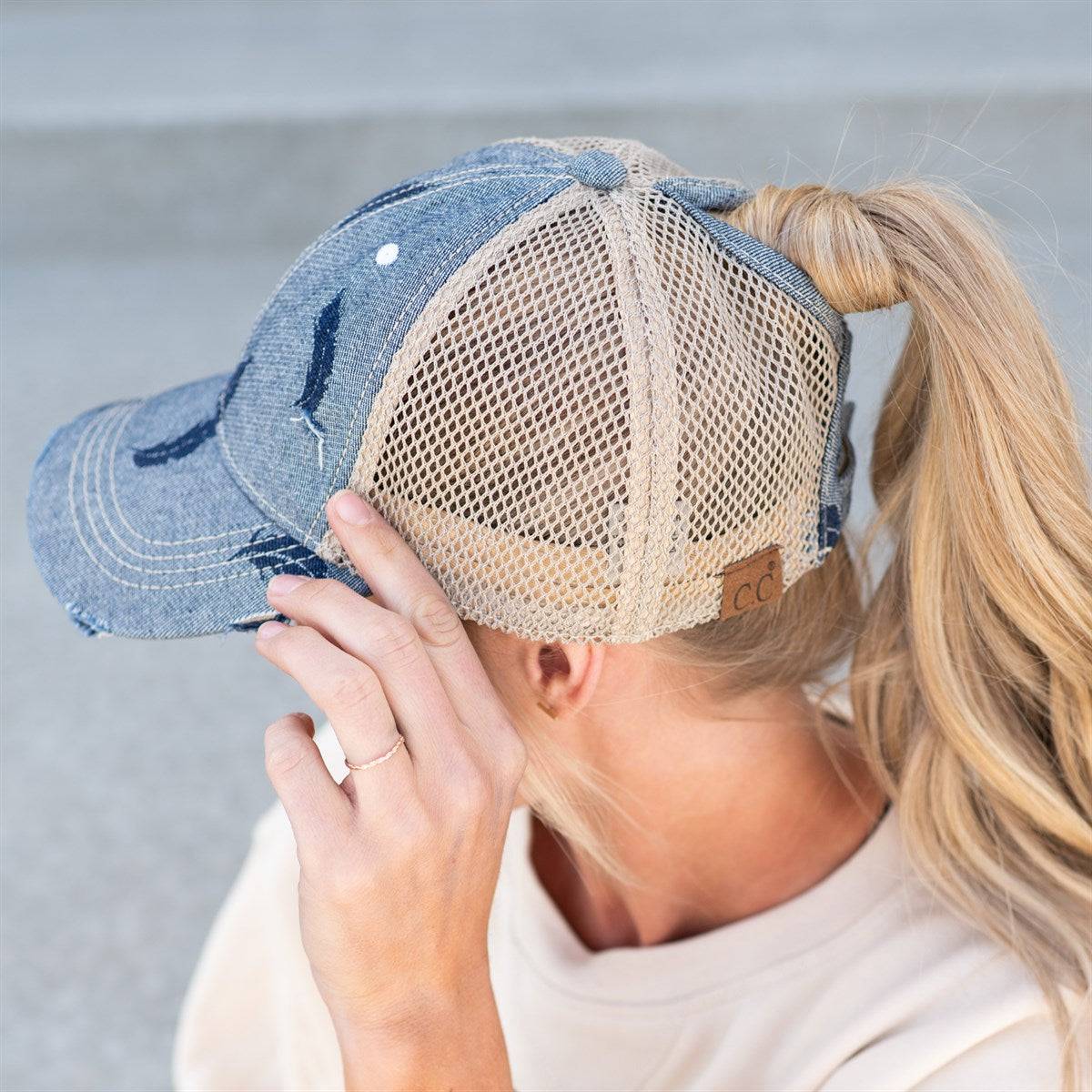 CC Leaf Motif Jacquard Denim Pony Cap featuring a stylish leaf pattern, adjustable velcro strap, and ponytail opening, suitable for women, teens, and kids.