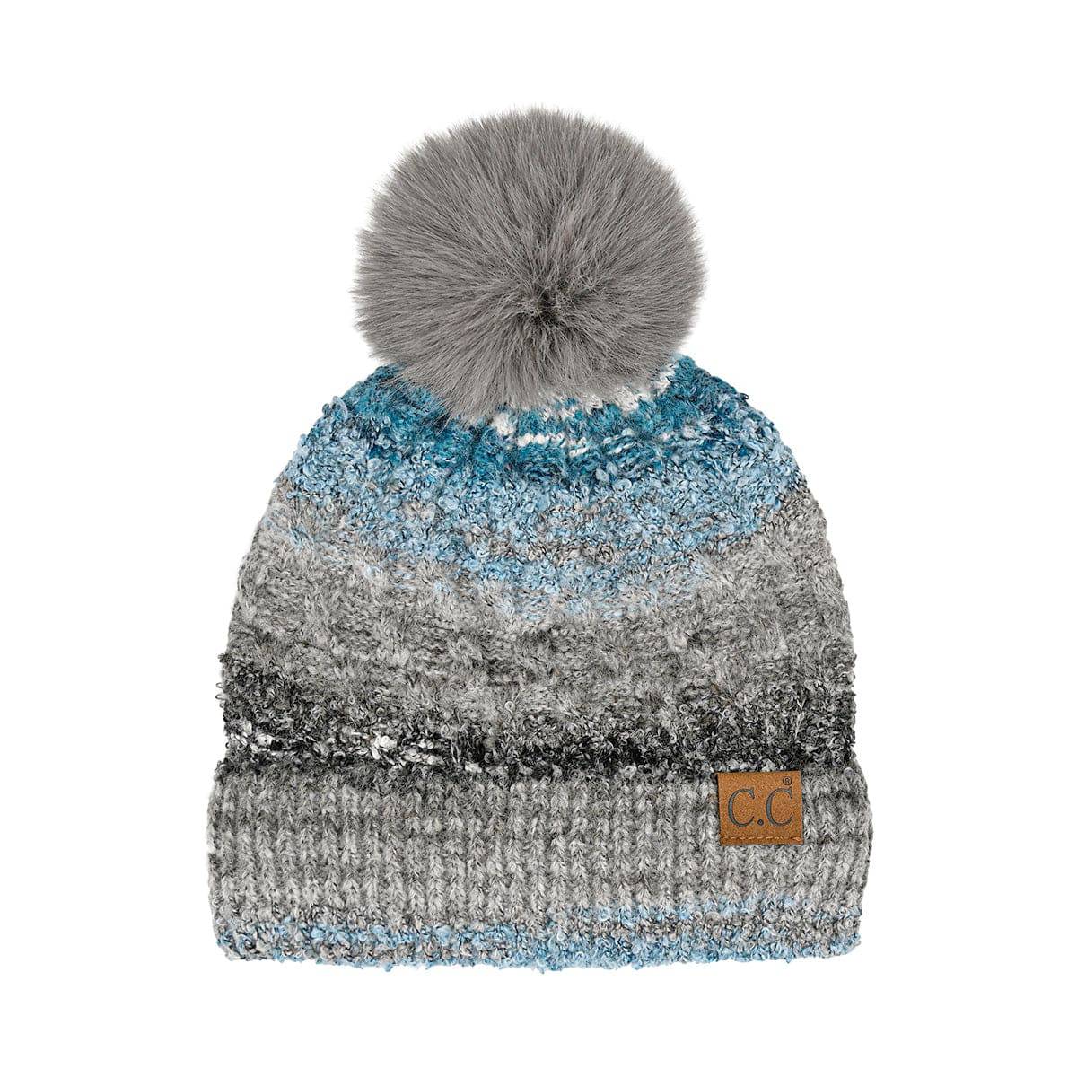 CC Multi Color Space Dye Pom Beanie featuring a vibrant multi-color design and a fluffy faux fur pom on top, suitable for teens and adults.