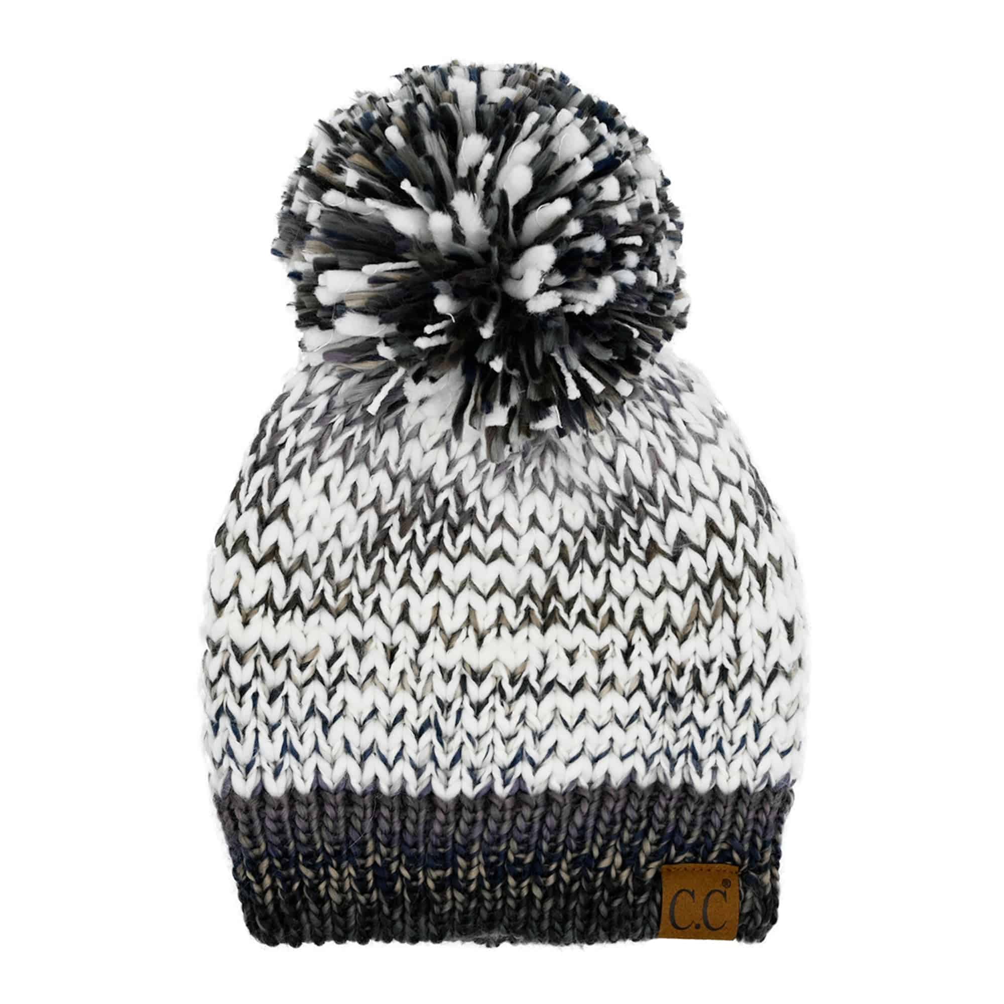 CC Multi-Color Yarn Beanie with Pom, featuring vibrant colors and a soft lining, perfect for winter wear.