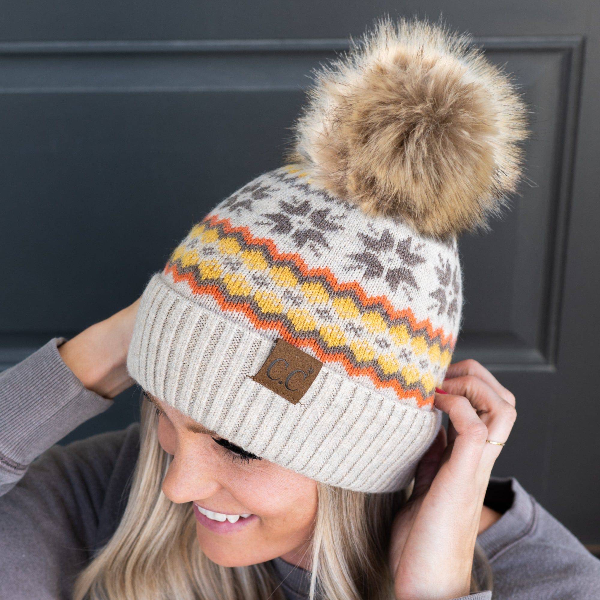 CC Nordic Fair Isle Beanie with faux fur pom, featuring a festive Fair Isle print, perfect for winter wear.