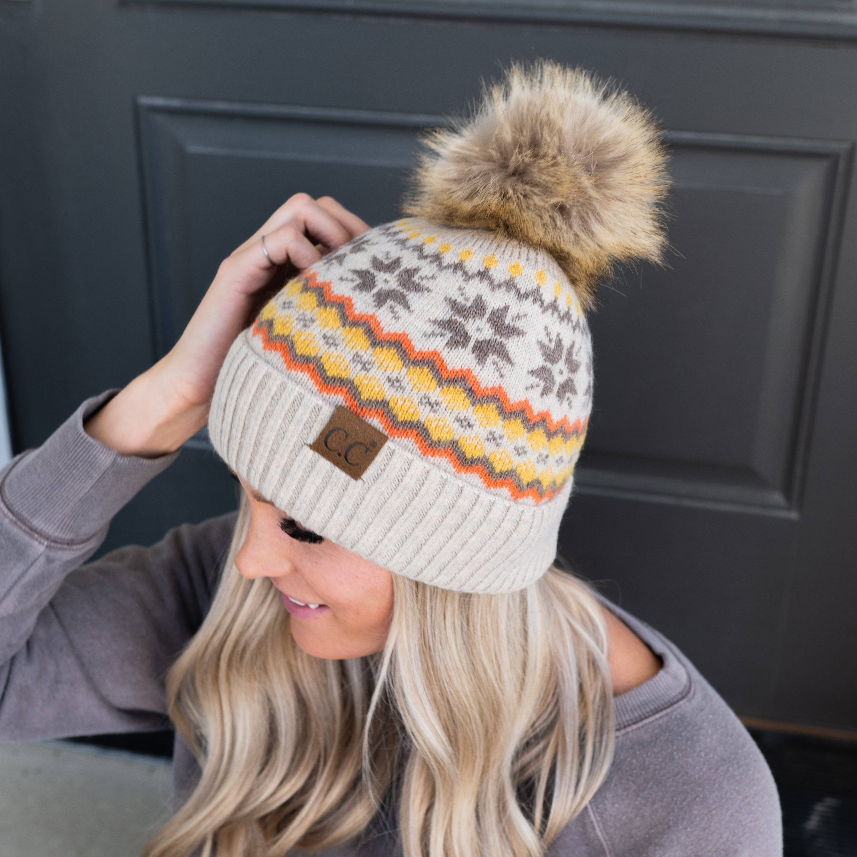 CC Nordic Fair Isle Beanie with faux fur pom, featuring a festive Fair Isle print, perfect for winter wear.