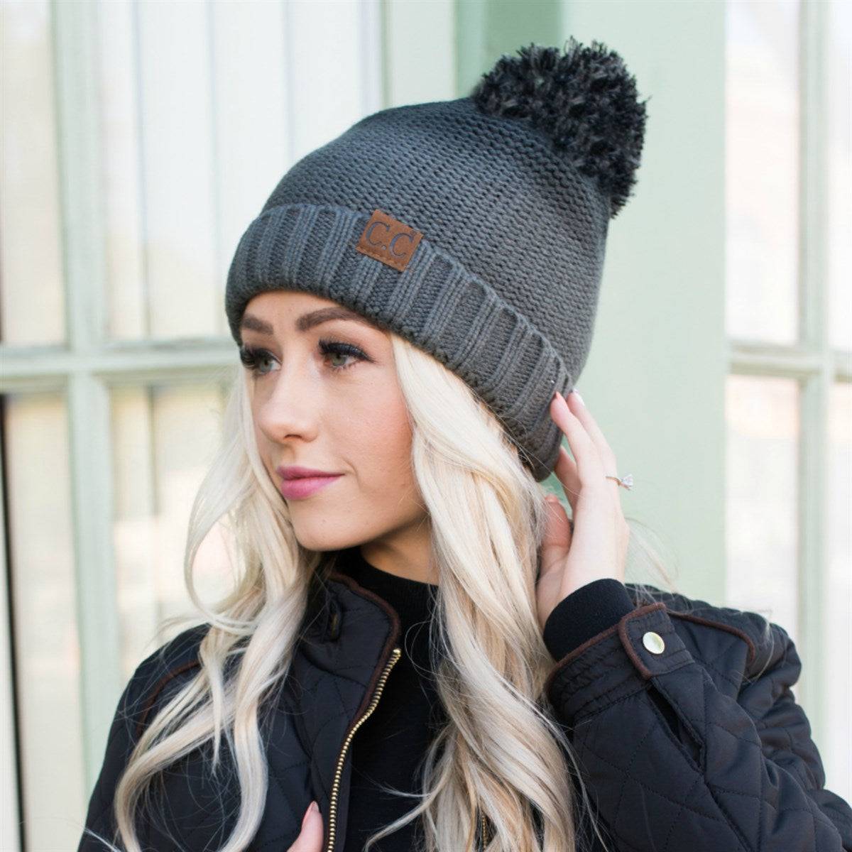 CC Ombre Beanie featuring a trendy ombre pattern and yarn pom, fleece lined for warmth and comfort.