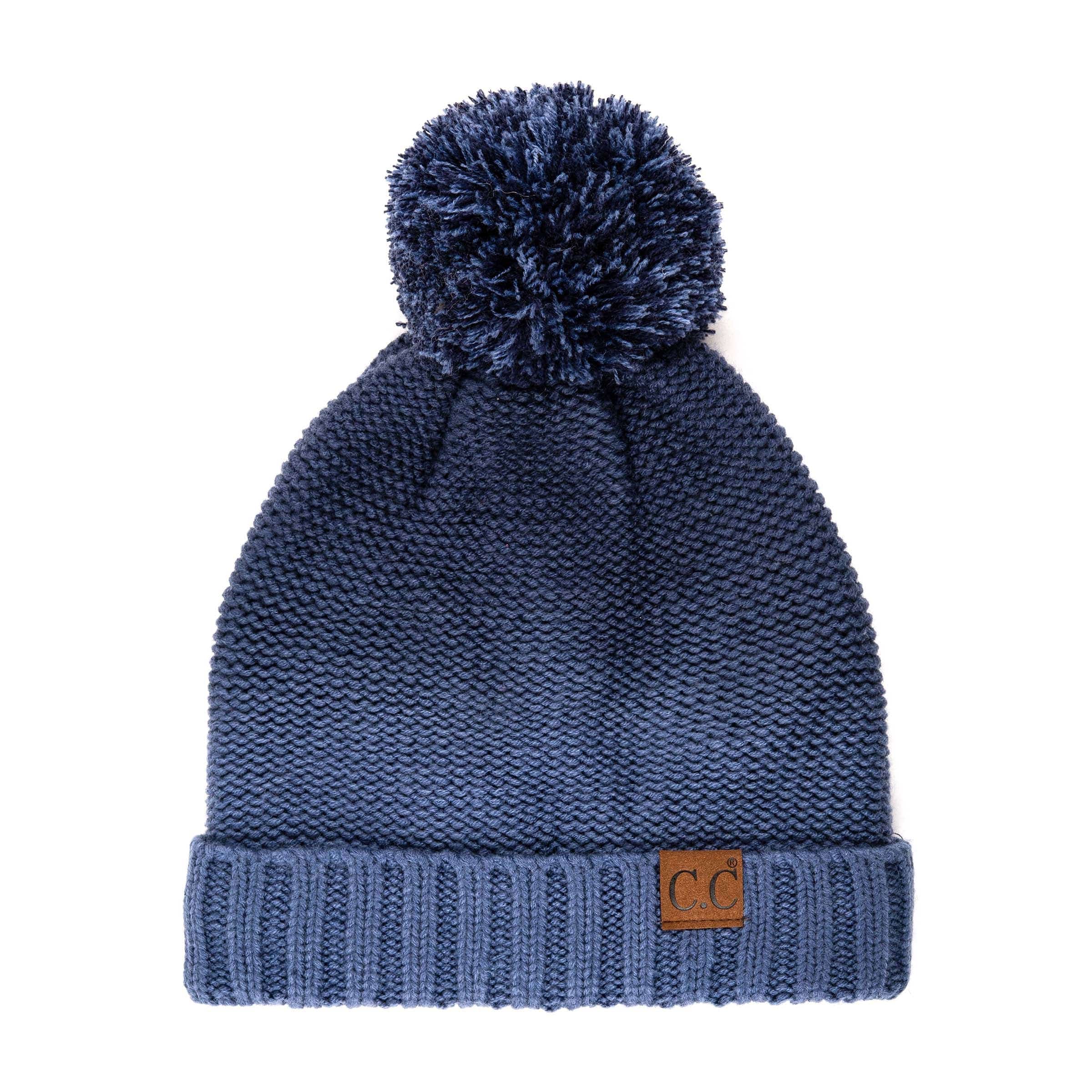 CC Ombre Beanie featuring a trendy ombre pattern and yarn pom, fleece lined for warmth and comfort.