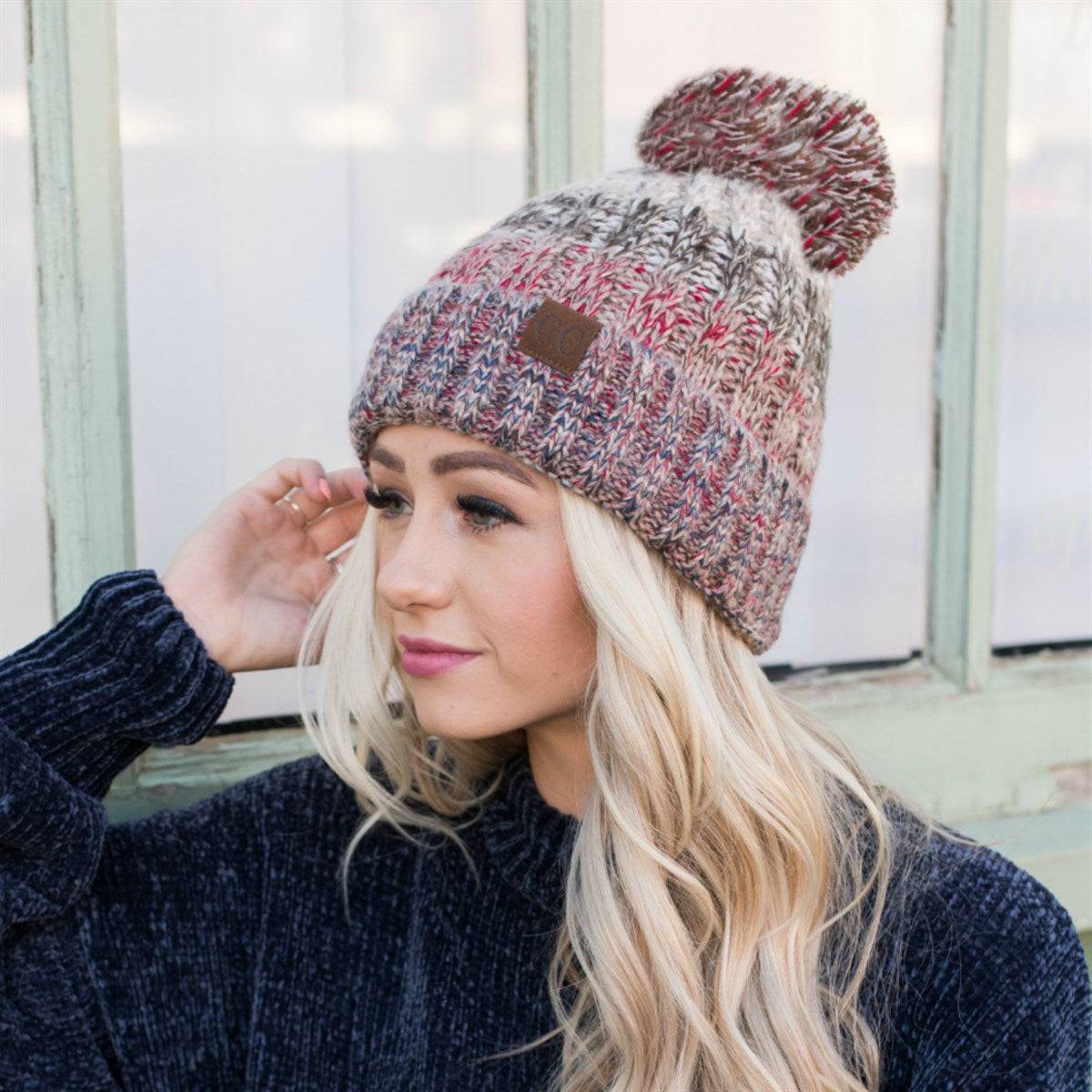 CC Park City Trending Beanie featuring Yarn Pom and multi-color stitching, fleece lined for warmth and comfort.