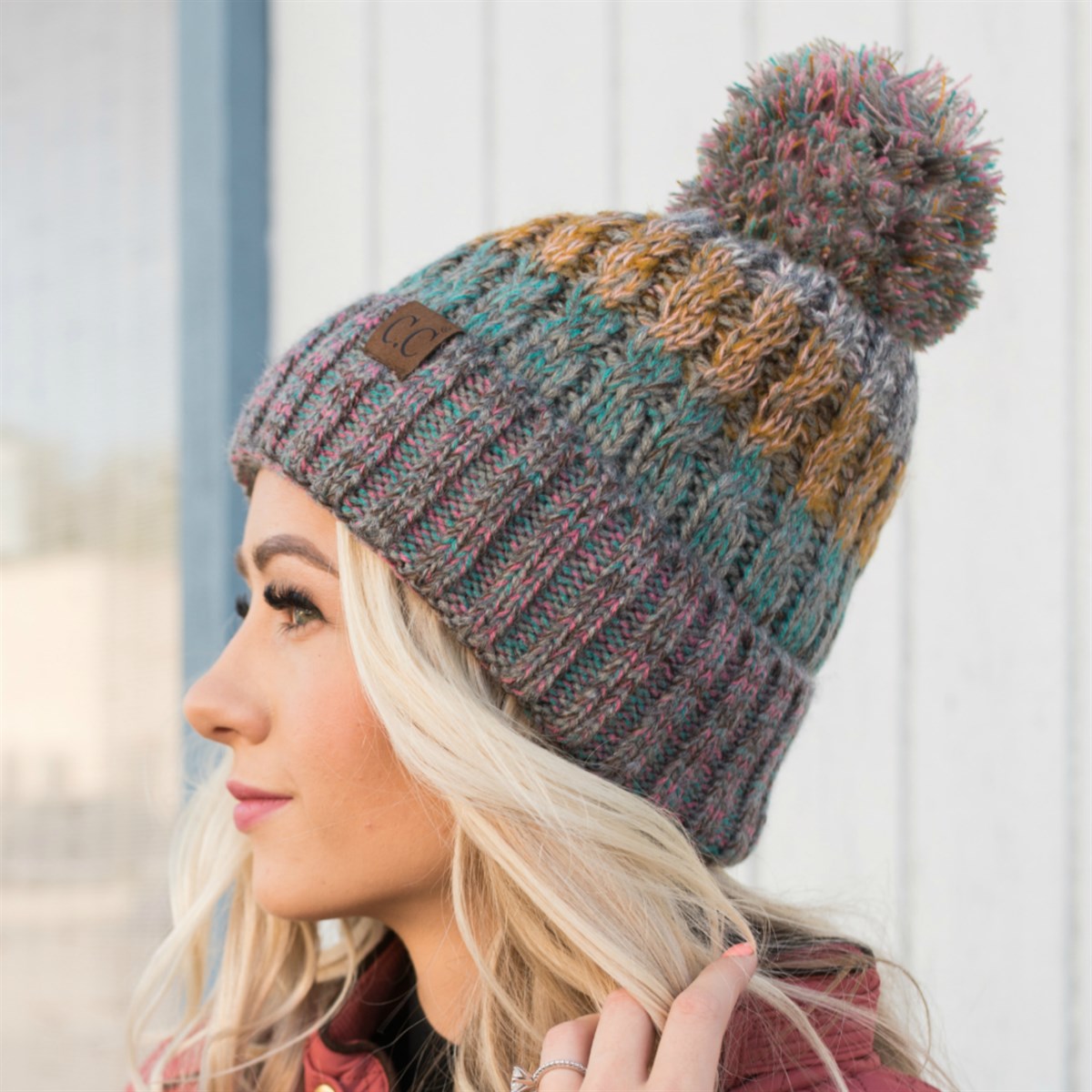 CC Park City Trending Beanie featuring Yarn Pom and multi-color stitching, fleece lined for warmth and comfort.