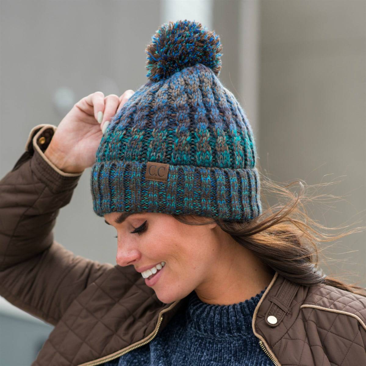 CC Park City Trending Beanie featuring Yarn Pom and multi-color stitching, fleece lined for warmth and comfort.