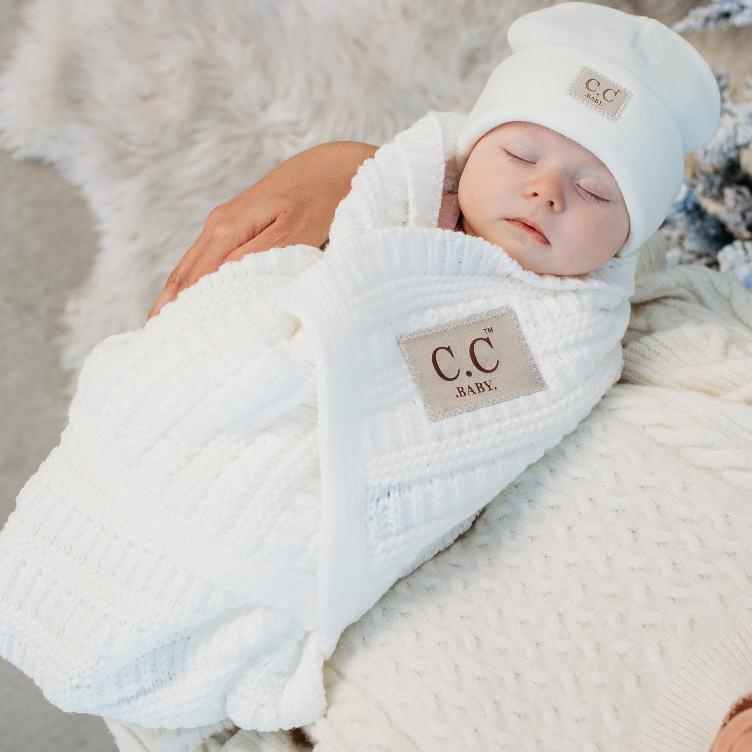 C.C® Popular Baby Blanket in luxurious cable knit design, showcasing detailed stitching and soft texture, perfect for babies.