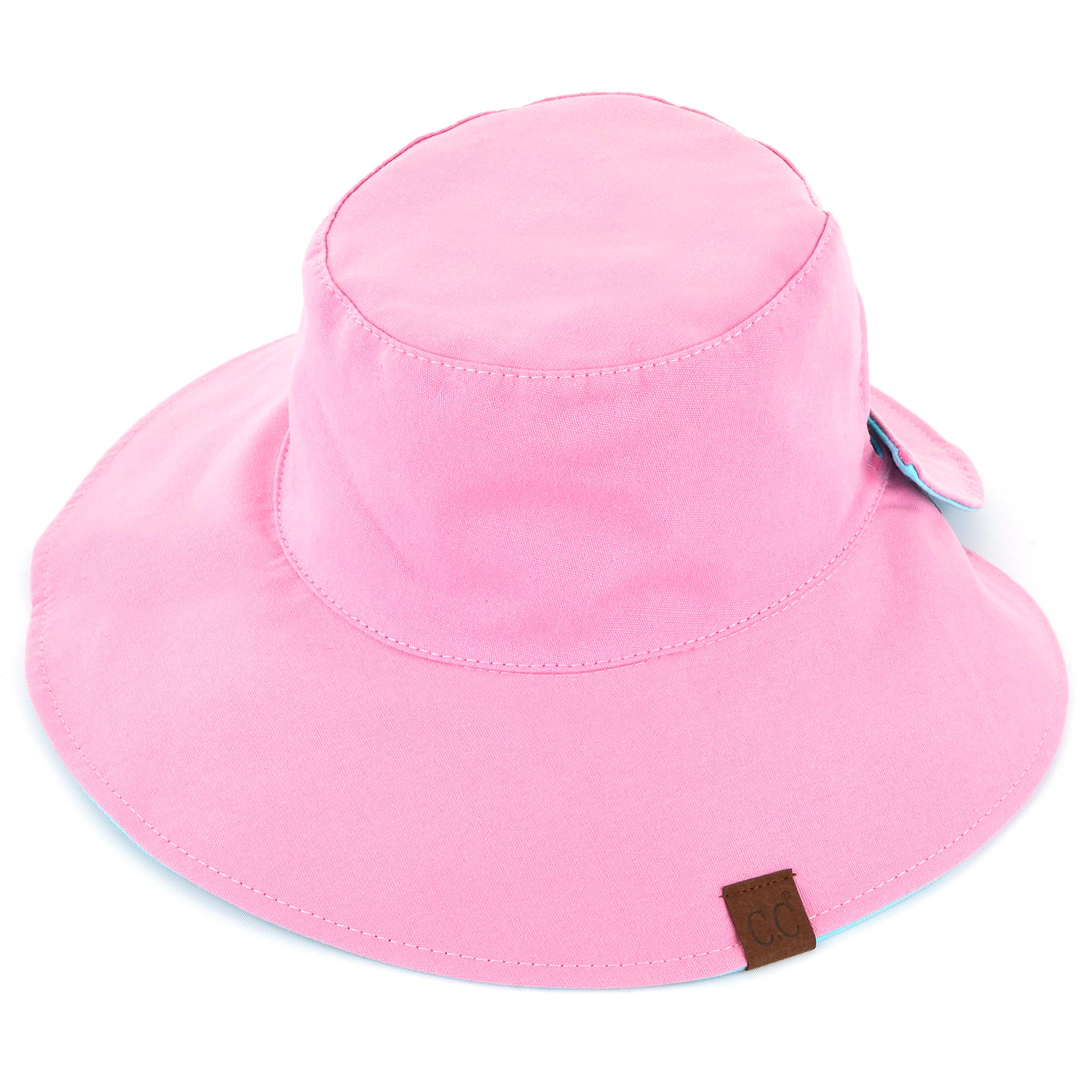 CC Reversible Ponytail Bucket Hat in two colors, featuring a ponytail opening and adjustable closure, perfect for sun protection.