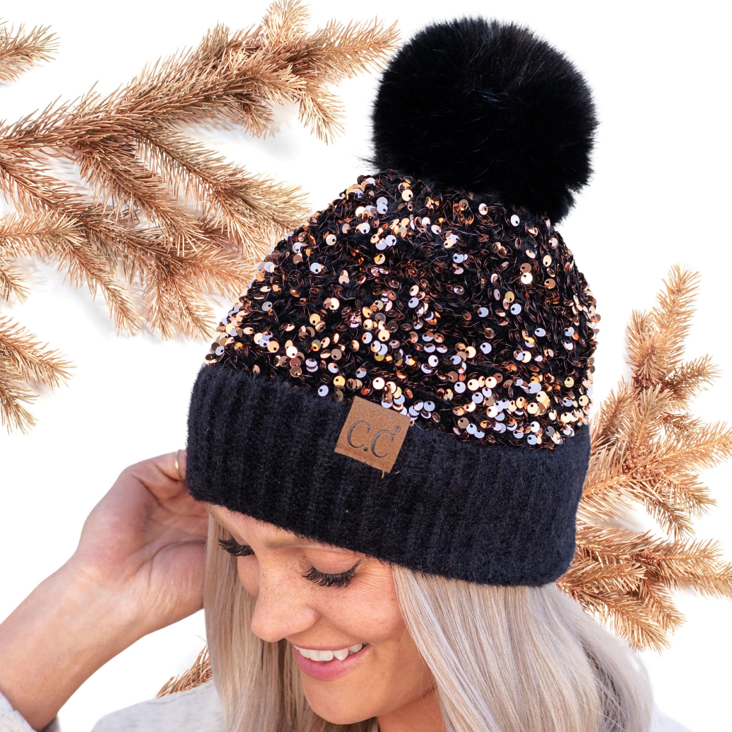 CC Sequin Fur Pom Beanie featuring a sparkling sequin design and a plush faux fur pom, available in adult and kid sizes.