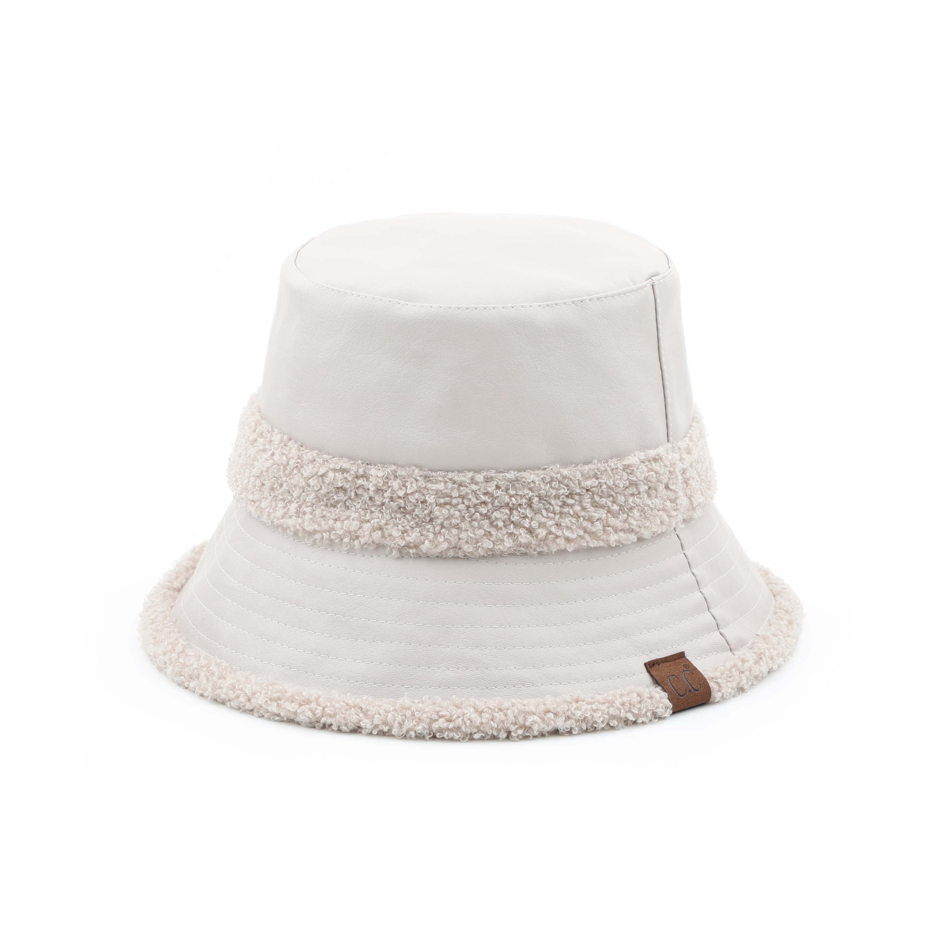 CC Sherpa Accent Reversible Bucket hat in cold weather, showcasing its stylish design and warm material.