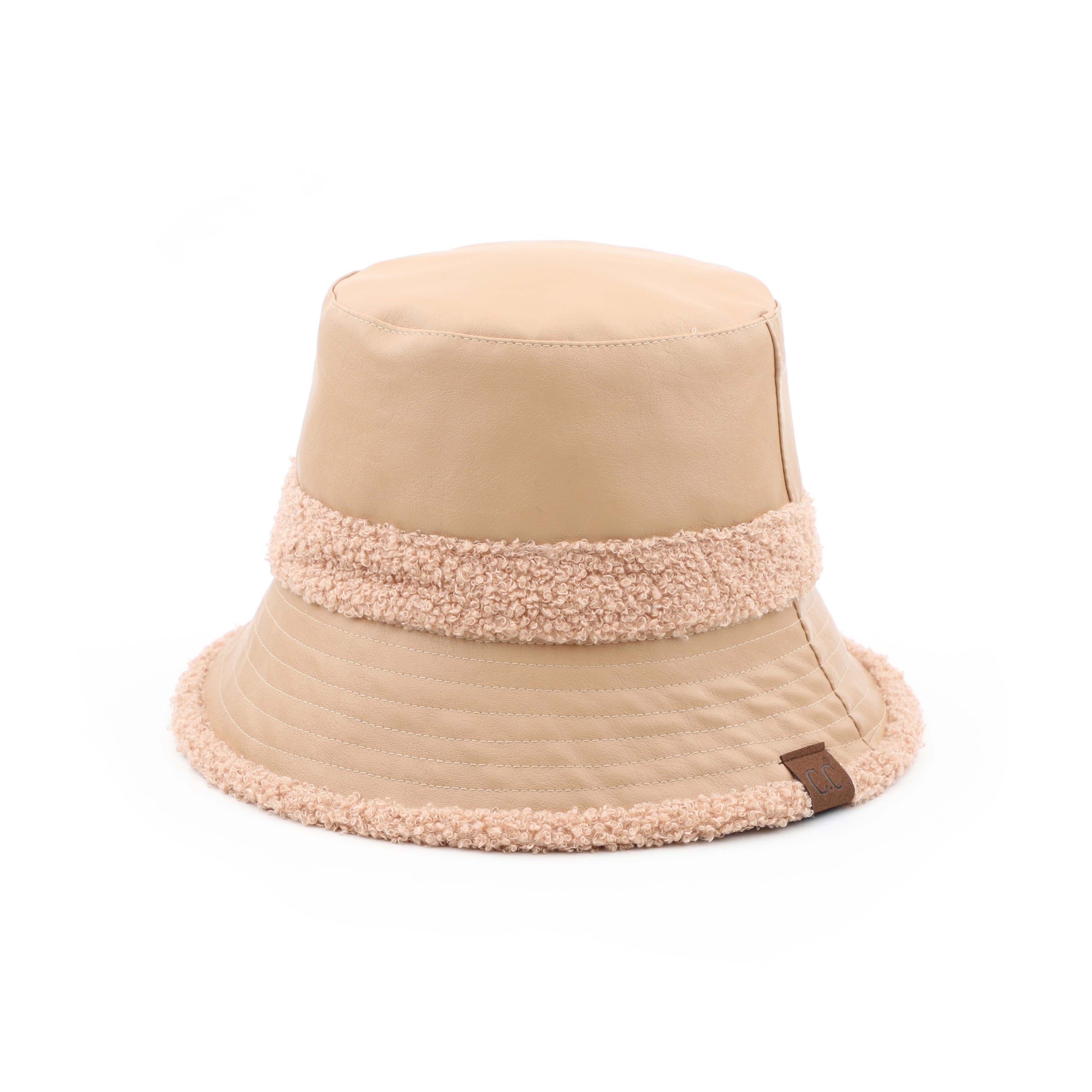 CC Sherpa Accent Reversible Bucket hat in cold weather, showcasing its stylish design and warm material.