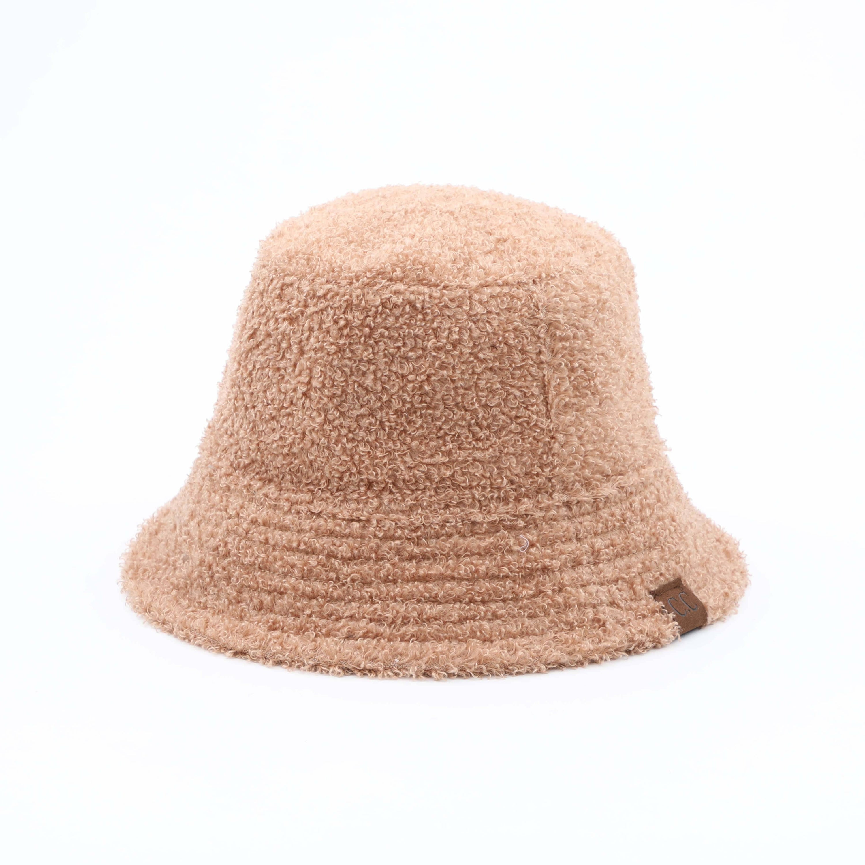 CC Sherpa Accent Reversible Bucket hat in cold weather, showcasing its stylish design and warm material.