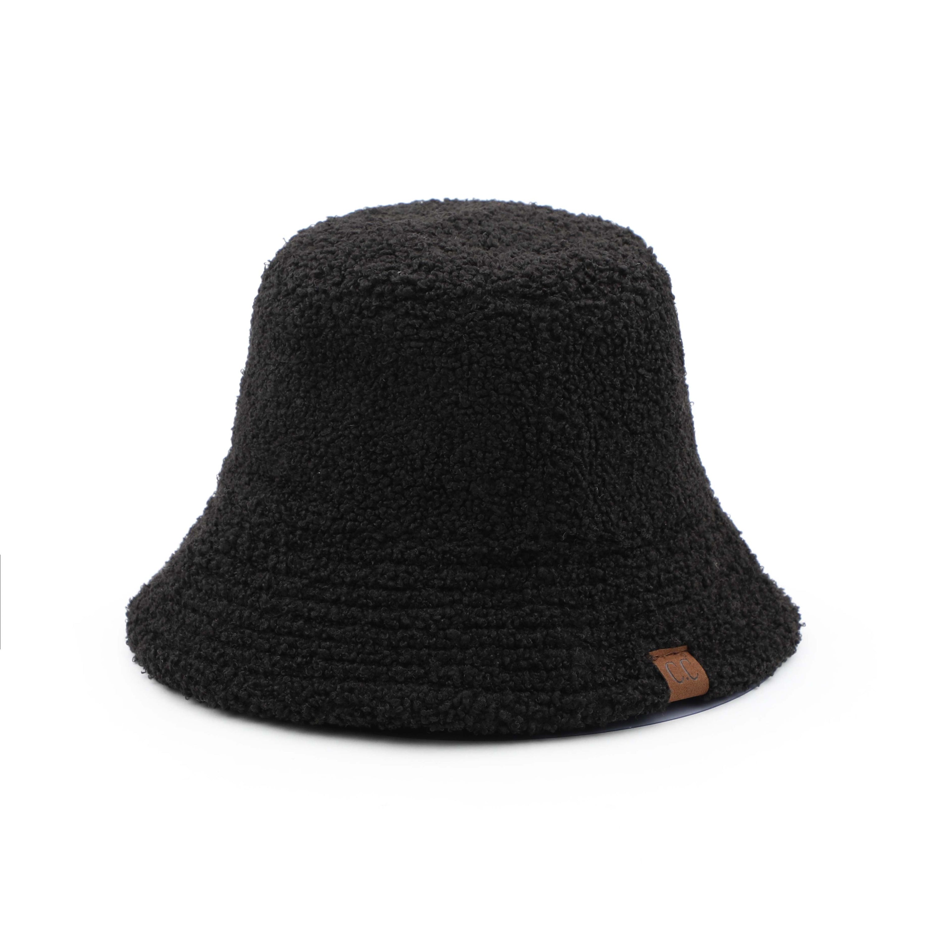 CC Sherpa Accent Reversible Bucket hat in cold weather, showcasing its stylish design and warm material.