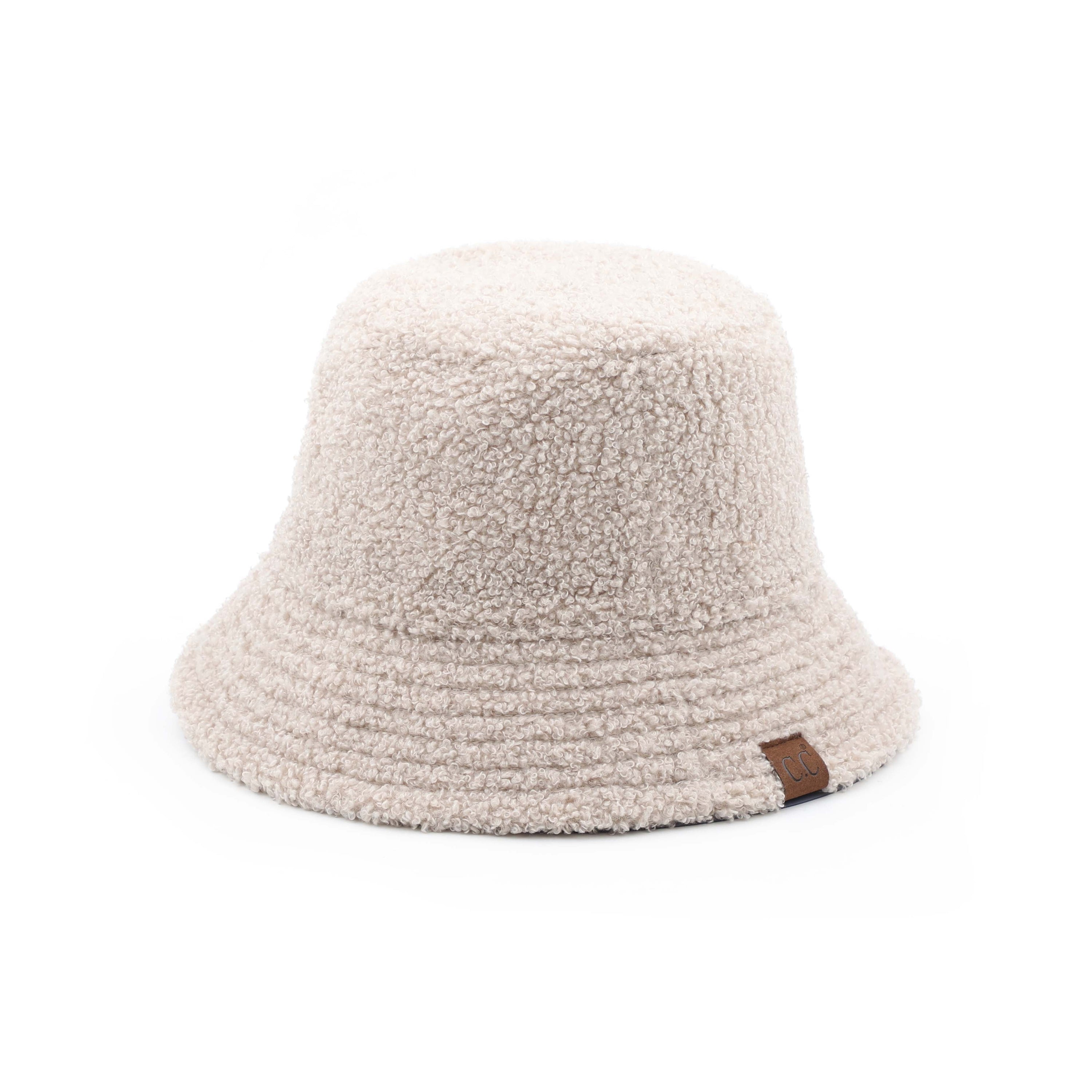 CC Sherpa Accent Reversible Bucket hat in cold weather, showcasing its stylish design and warm material.