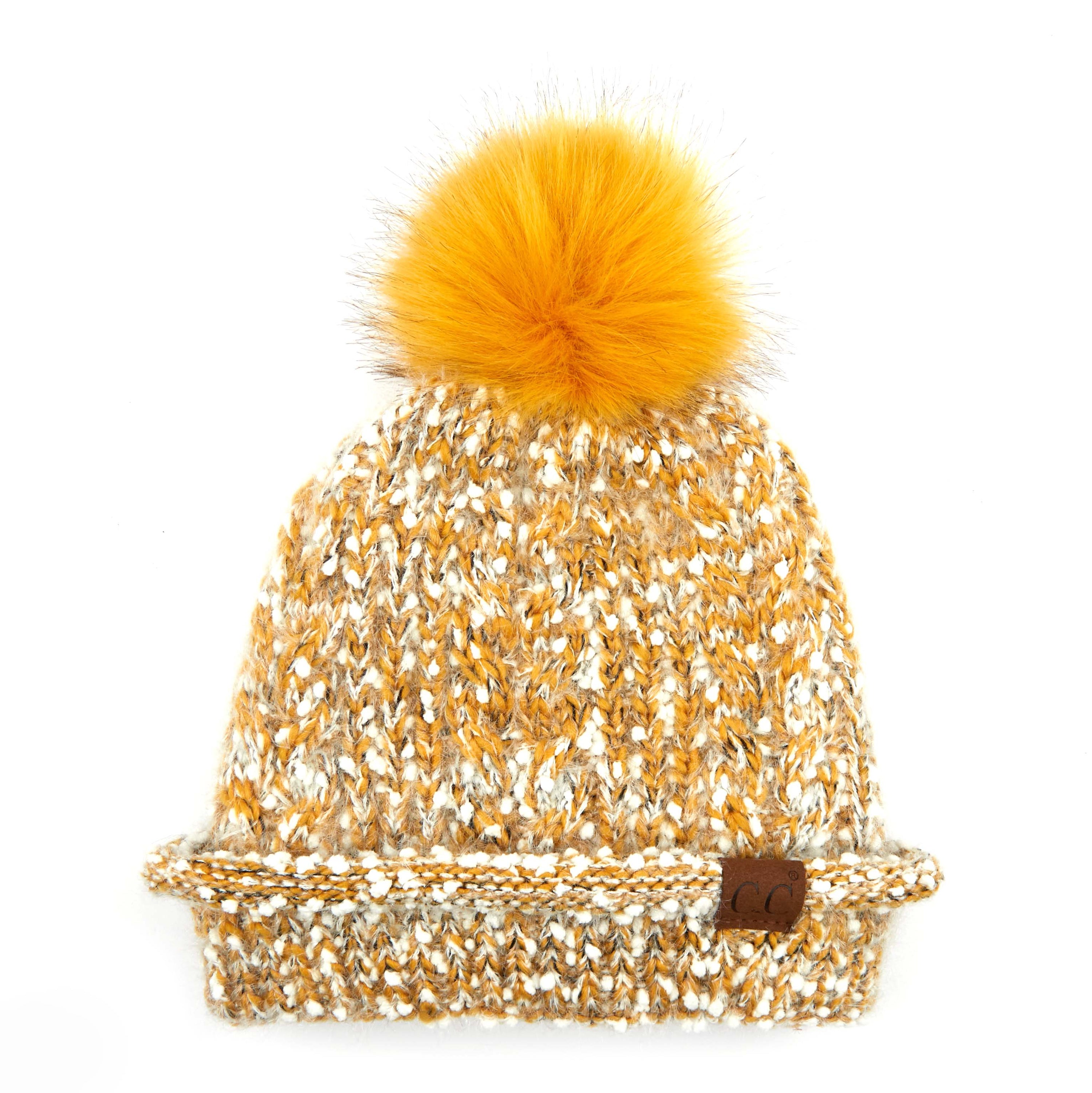 CC Speck Lined Beanie featuring a faux fur pom and speck pattern, perfect for cold weather wear.