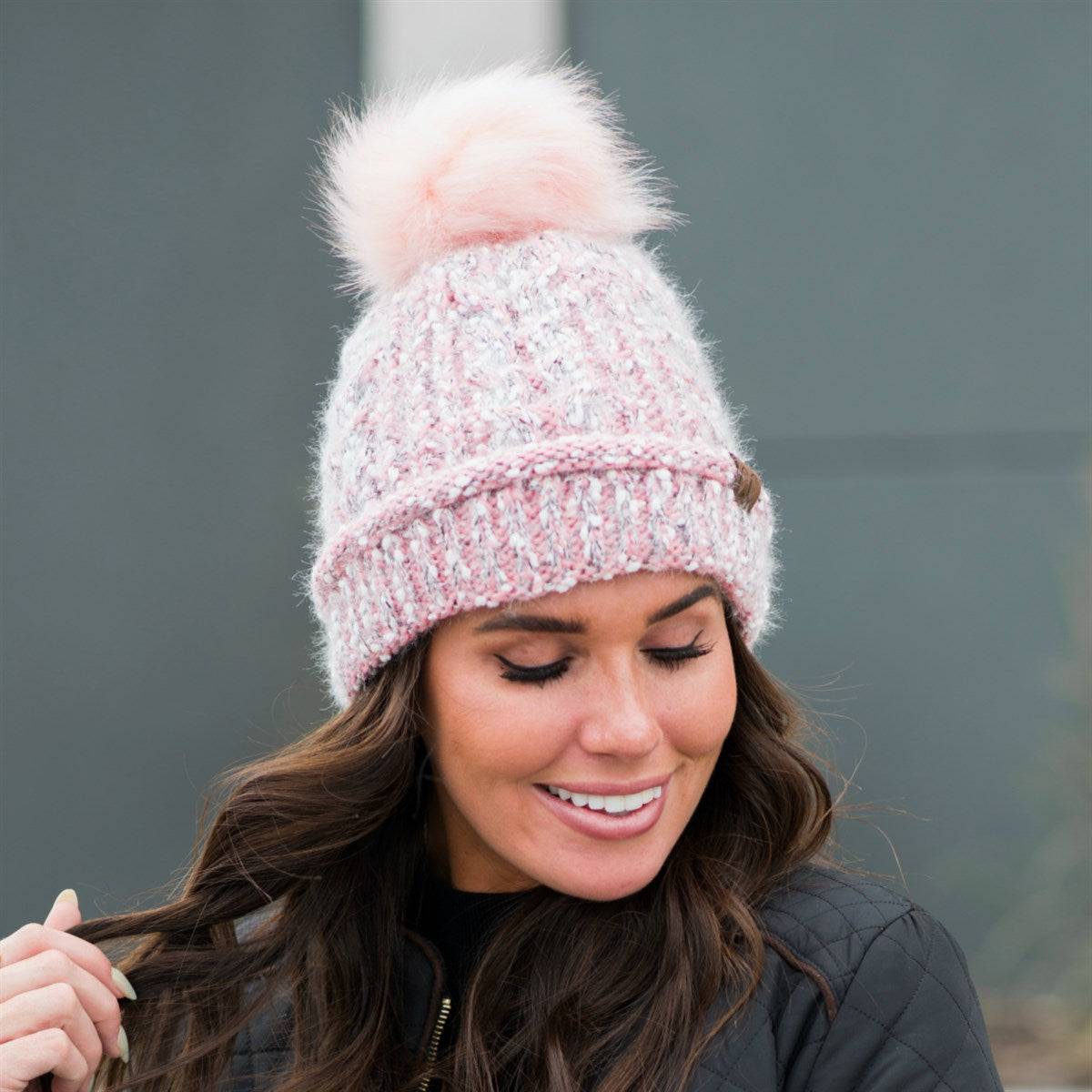 CC Speck Lined Beanie featuring a faux fur pom and speck pattern, perfect for cold weather wear.