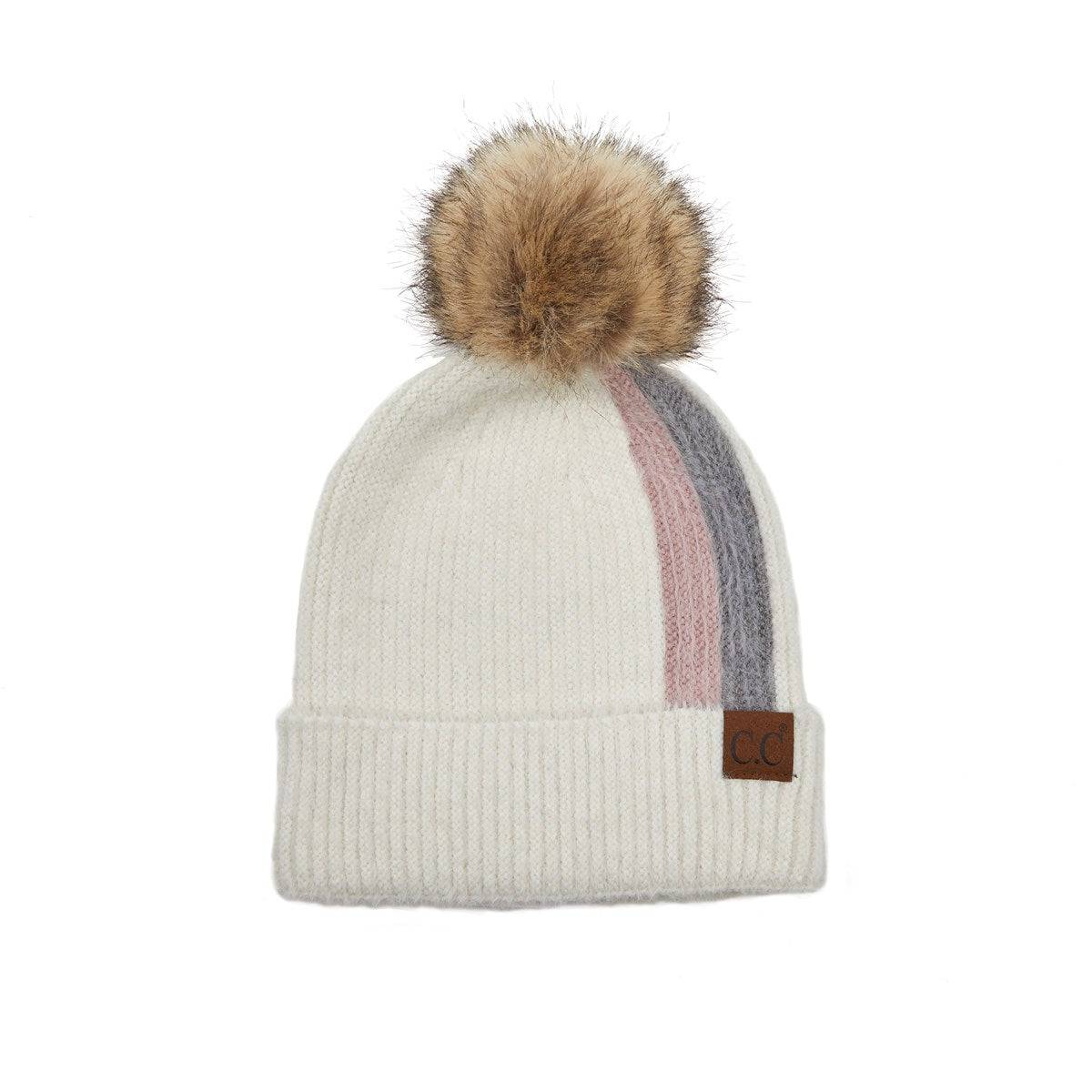 CC Sport Stripe Beanie featuring a soft faux fur pom-pom and stylish stripe design, perfect for winter wear.