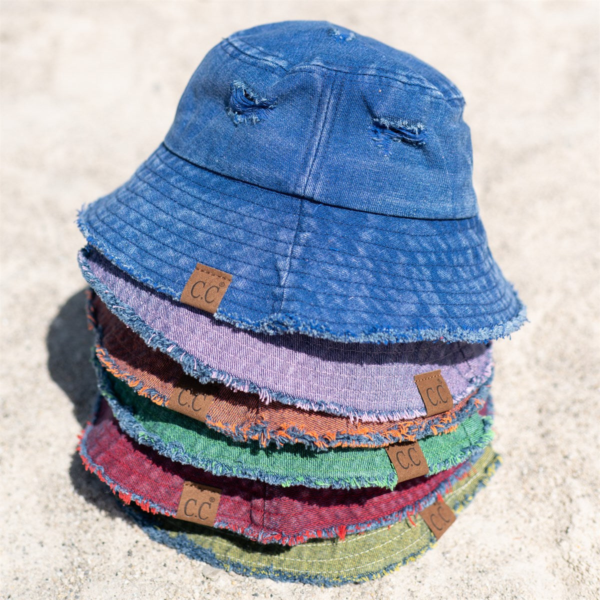 CC Stone Washed Denim Bucket hat with adjustable inner band, showcasing a trendy stone-wash finish, perfect for outdoor activities.