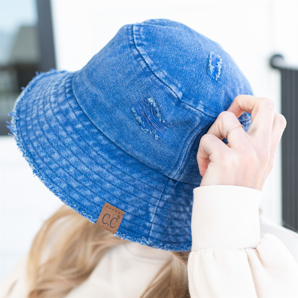 CC Stone Washed Denim Bucket hat with adjustable inner band, showcasing a trendy stone-wash finish, perfect for outdoor activities.