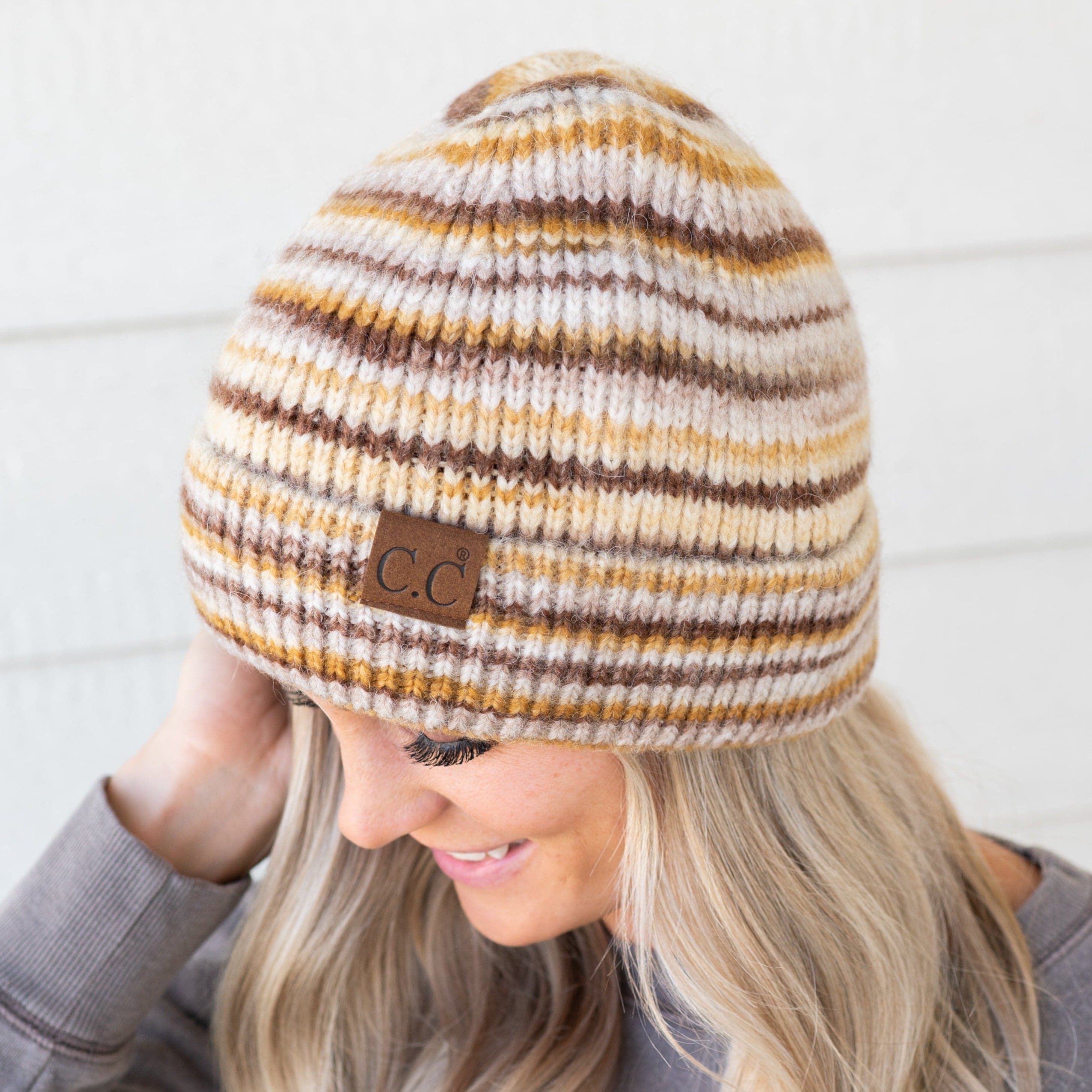 CC Stripe Color Block Beanie in various trendy colors, showcasing its soft fabric and versatile folded band design.