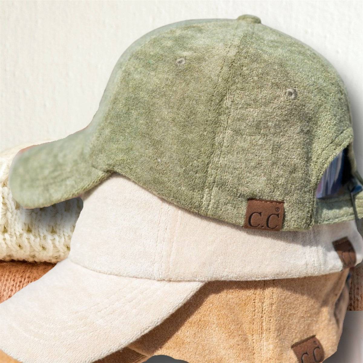 CC Terry Cloth Women Baseball Trucker Cap featuring a low ponytail opening, adjustable velcro back, and soft terry cloth material.