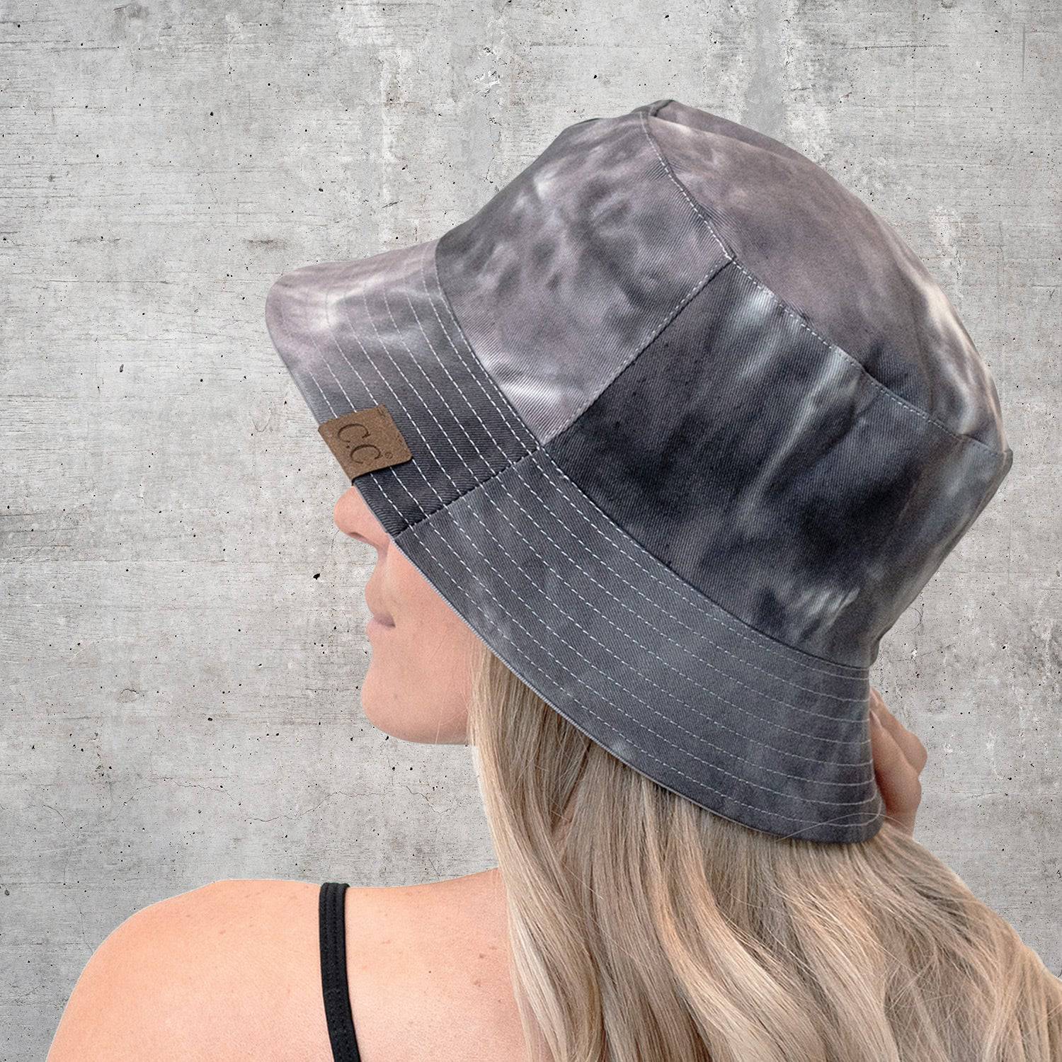 CC Tie-Dye Reversible Bucket Hat showcasing vibrant tie-dye pattern and solid color, perfect for youth and adults.