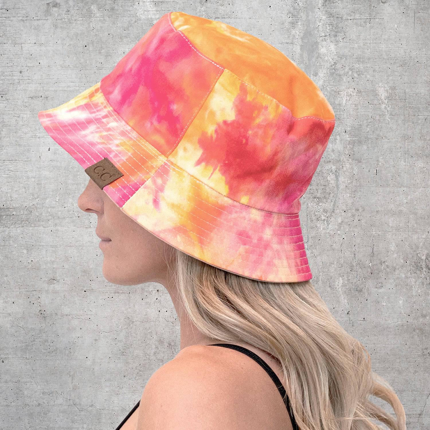 CC Tie-Dye Reversible Bucket Hat showcasing vibrant tie-dye pattern and solid color, perfect for youth and adults.