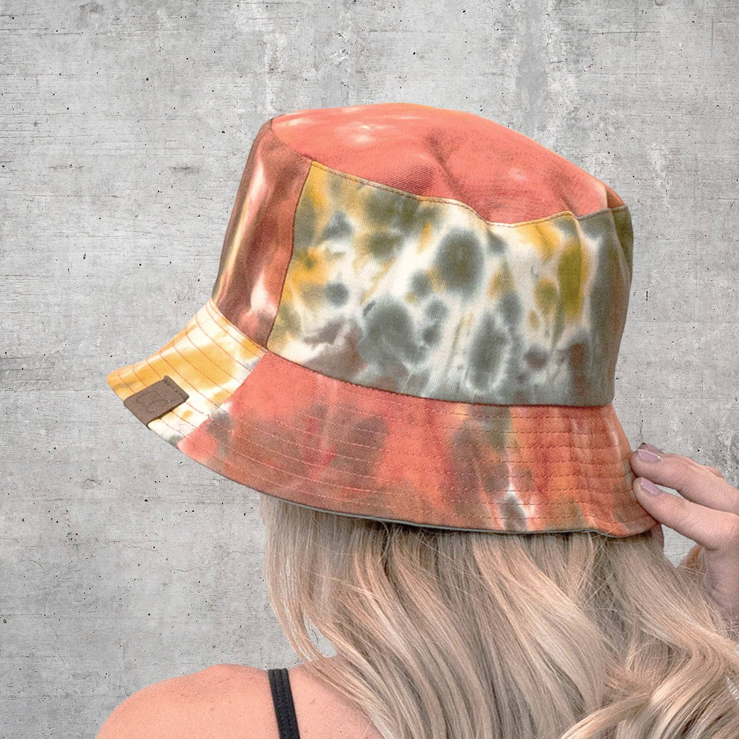 CC Tie-Dye Reversible Bucket Hat showcasing vibrant tie-dye pattern and solid color, perfect for youth and adults.