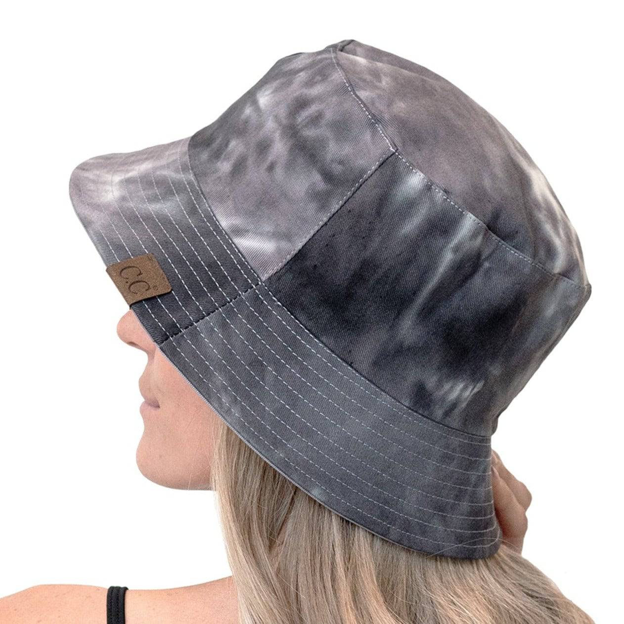 CC Tie-Dye Reversible Bucket Hat showcasing vibrant tie-dye pattern and solid color, perfect for youth and adults.