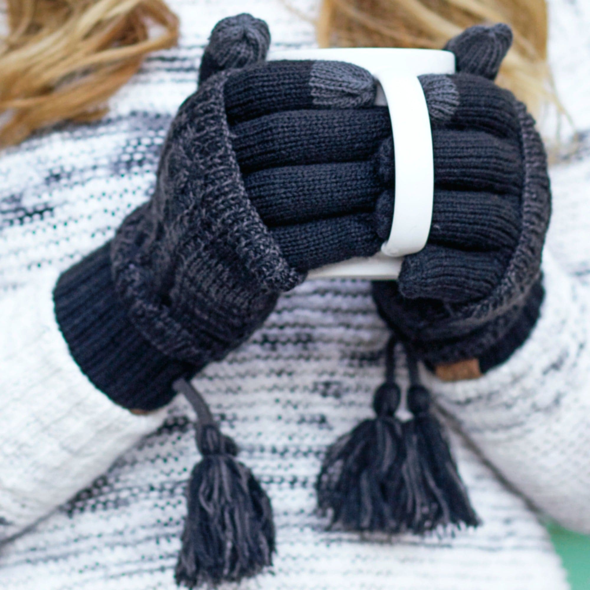 CC Touchscreen Gloves with removable cuff and pom, showcasing a stylish cable knit pattern in soft acrylic material.