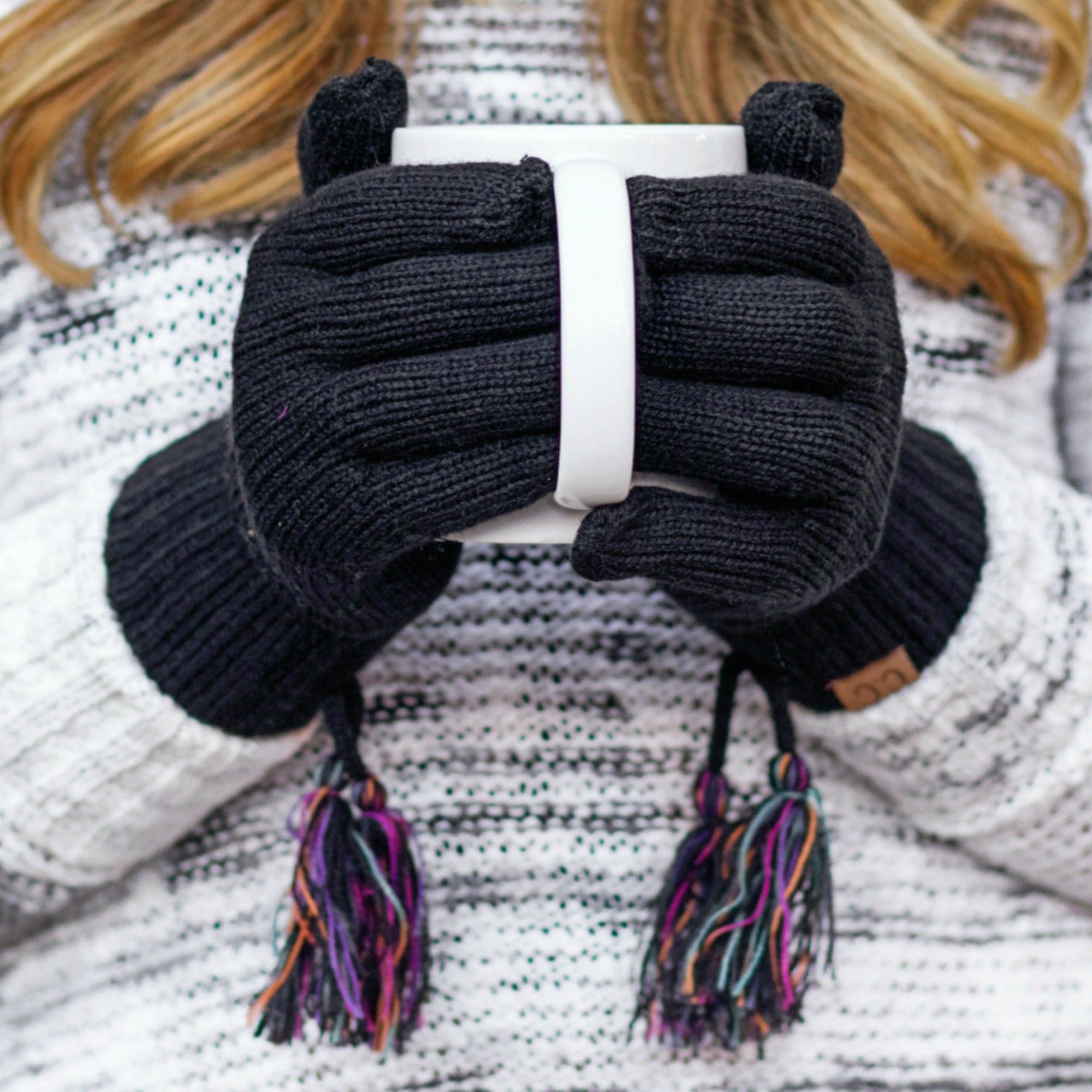 CC Touchscreen Gloves with removable cuff and tassel, showcasing a stylish cable knit pattern.