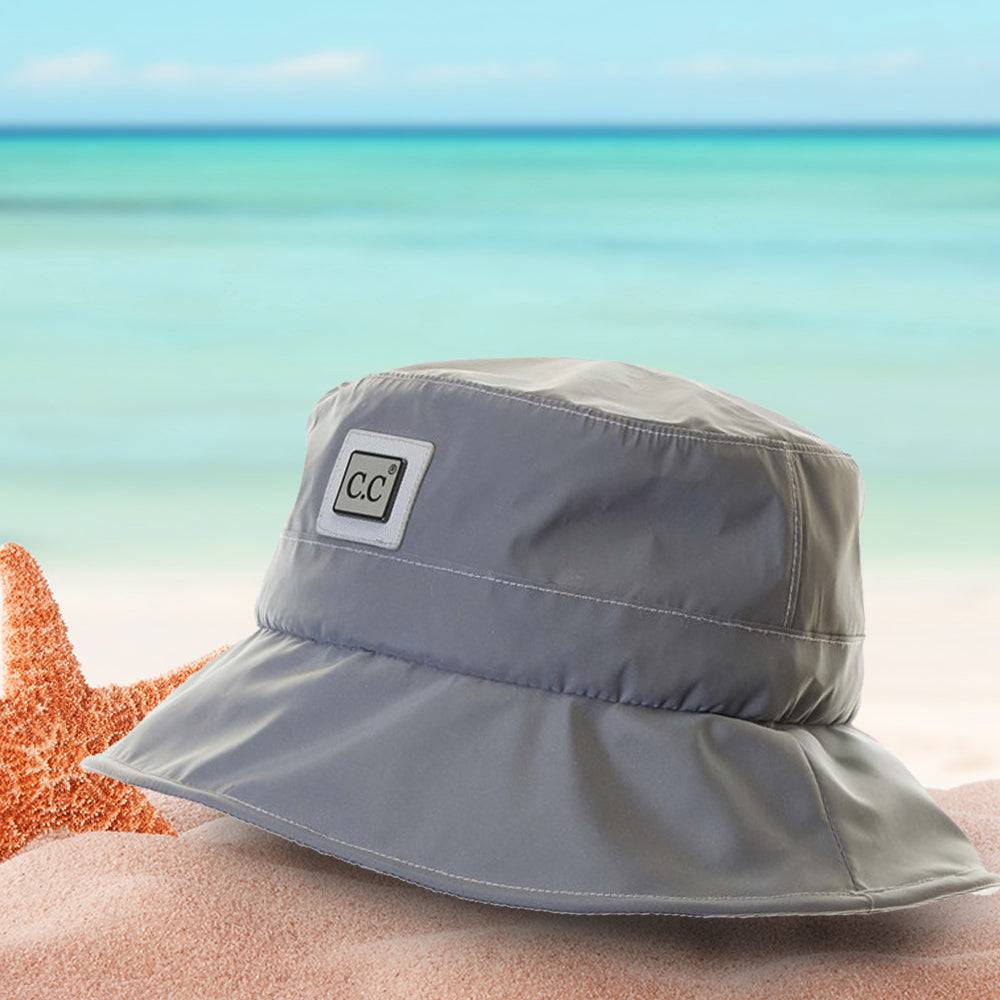 CC Waterproof Reflective Bucket Hat showcasing its stylish design, adjustable chin strap, and waterproof material, perfect for outdoor activities.