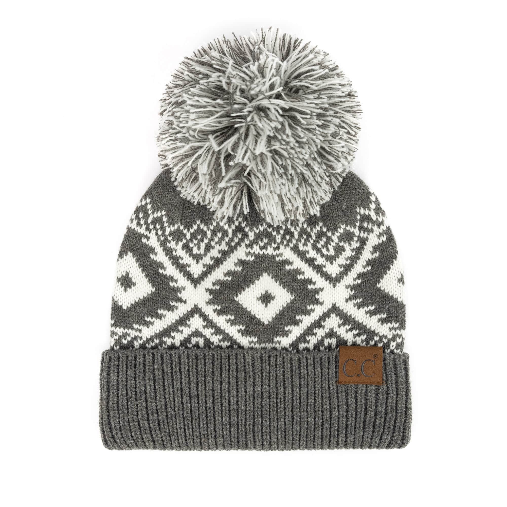 CC Western Print Beanie featuring a bold Aztec pattern and yarn pom, made from 100% acrylic for warmth and comfort.