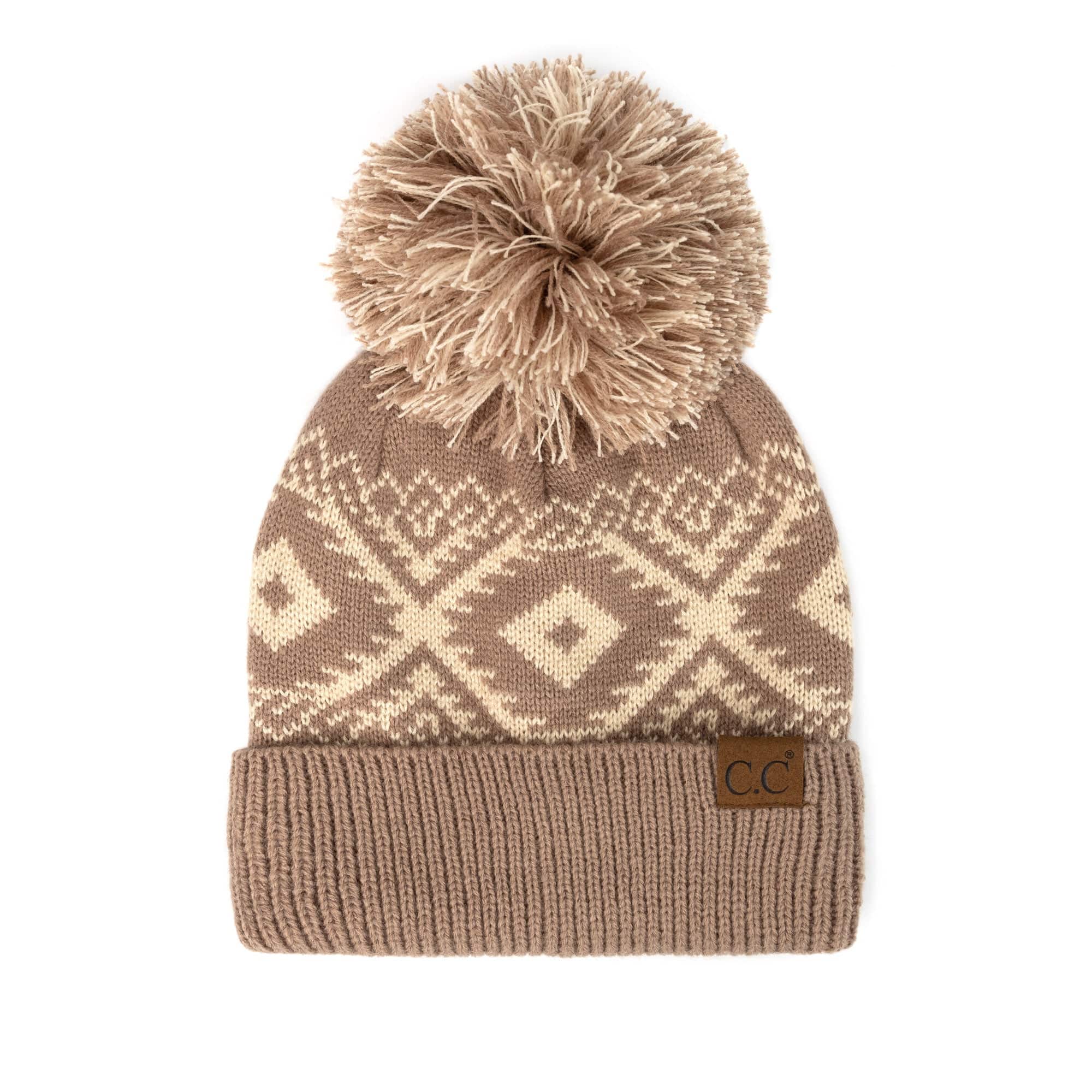 CC Western Print Beanie featuring a bold Aztec pattern and yarn pom, made from 100% acrylic for warmth and comfort.