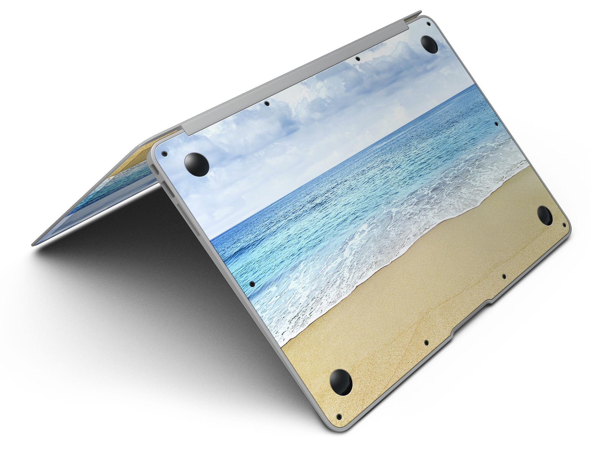 Calm Blue Sky and Sea Shore MacBook Air Skin Kit showcasing vibrant blue and sandy shore design on a sleek MacBook Air.