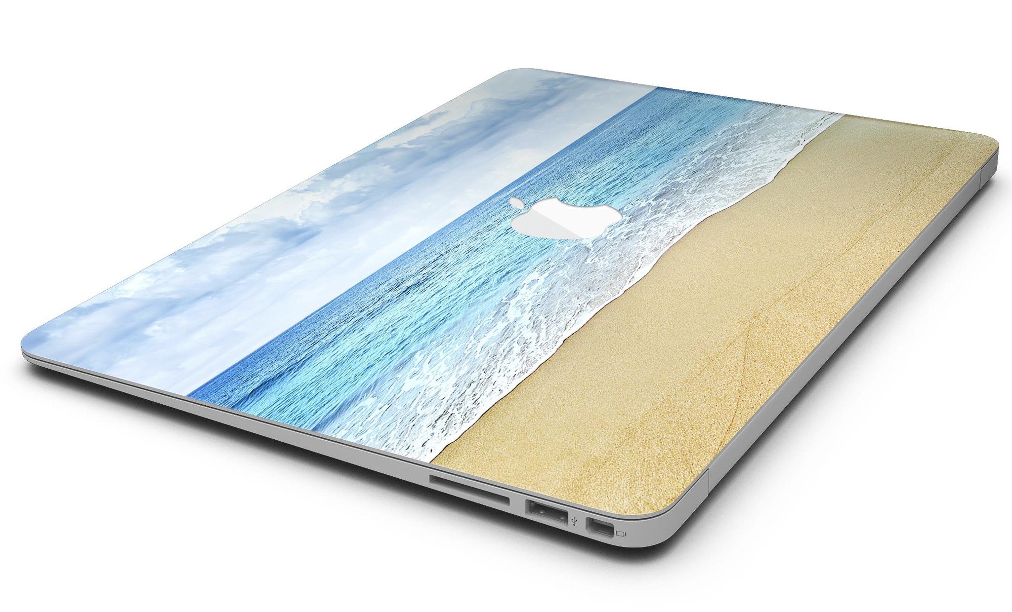 Calm Blue Sky and Sea Shore MacBook Air Skin Kit showcasing vibrant blue and sandy shore design on a sleek MacBook Air.